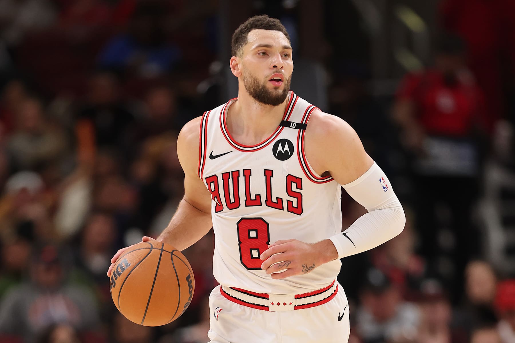 CHICAGO, ILLINOIS - DECEMBER 08: Zach LaVine #8 of the Chicago Bulls dribbles up the court against the Philadelphia 76ers during the second half at the United Center on December 08, 2024 in Chicago, Illinois. NOTE TO USER: User expressly acknowledges and agrees that, by downloading and or using this photograph, User is consenting to the terms and conditions of the Getty Images License Agreement.  (Photo by Michael Reaves/Getty Images)