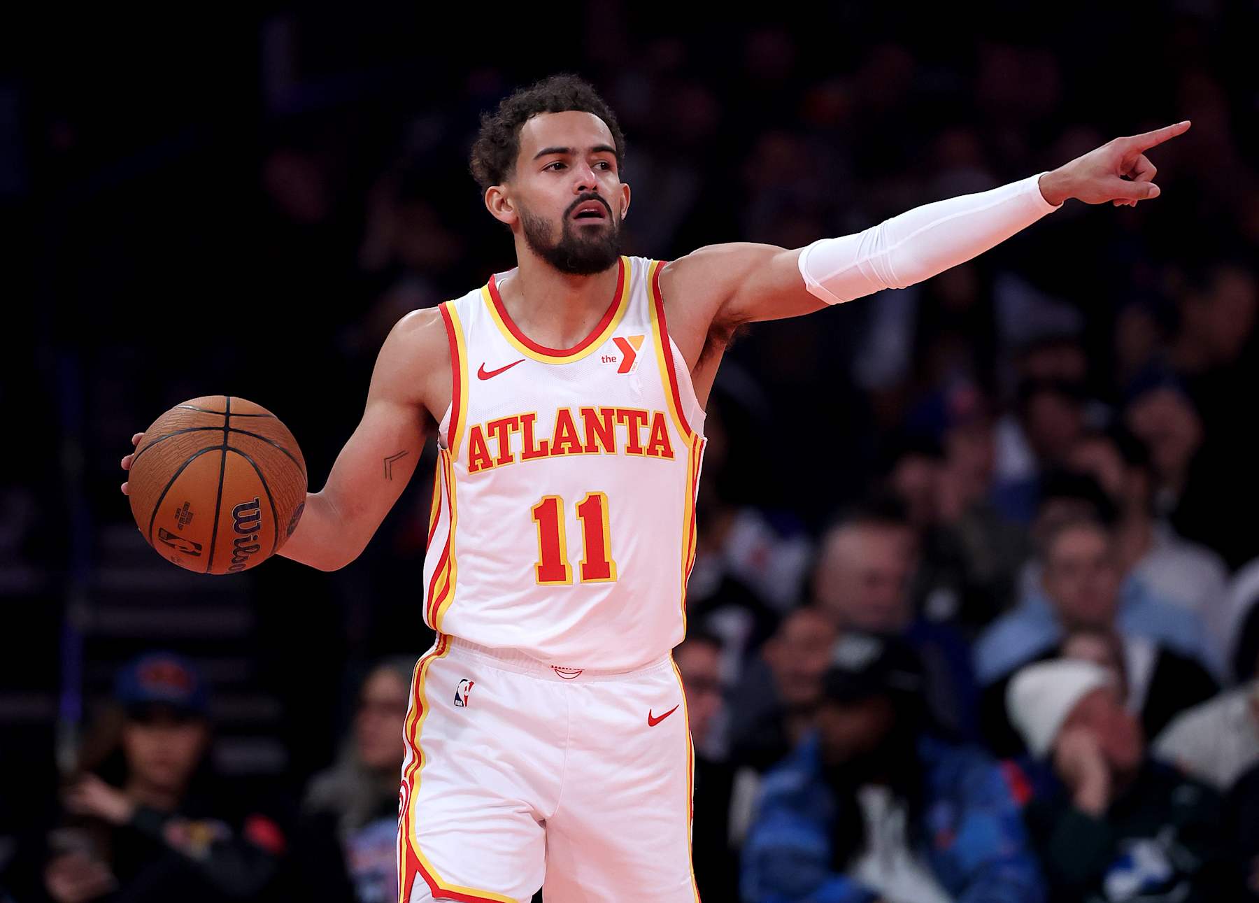 NEW YORK, NEW YORK - DECEMBER 11:  Trae Young #11 of the Atlanta Hawks directs his teammates during the first half of the quarterfinal game of the Emirates NBA Cup against the New York Knicks at Madison Square Garden on December 11, 2024 in New York City. NOTE TO USER: User expressly acknowledges and agrees that, by downloading and or using this photograph, User is consenting to the terms and conditions of the Getty Images License Agreement. (Photo by Elsa/Getty Images)