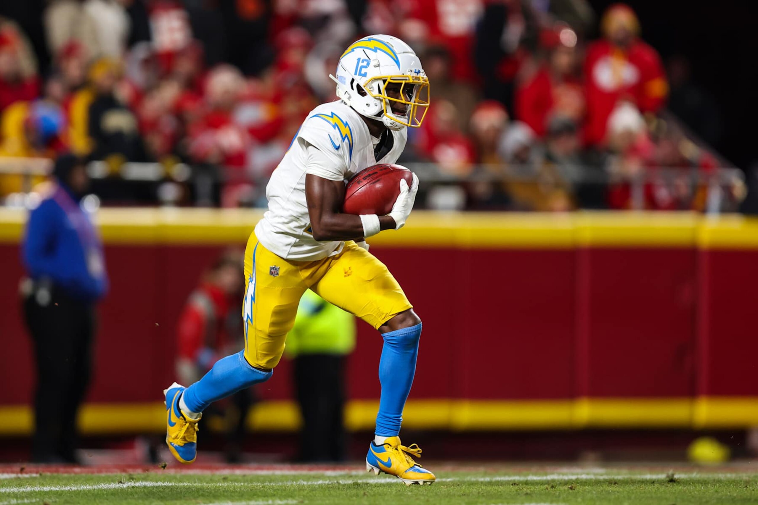 KANSAS CITY, MISSOURI - DECEMBER 08: Derius Davis #12 of the Los Angeles Chargers runs the ball during an NFL football game against the Kansas City Chiefs at GEHA Field at Arrowhead Stadium on December 8, 2024 in Kansas City, Missouri. (Photo by Perry Knotts/Getty Images)