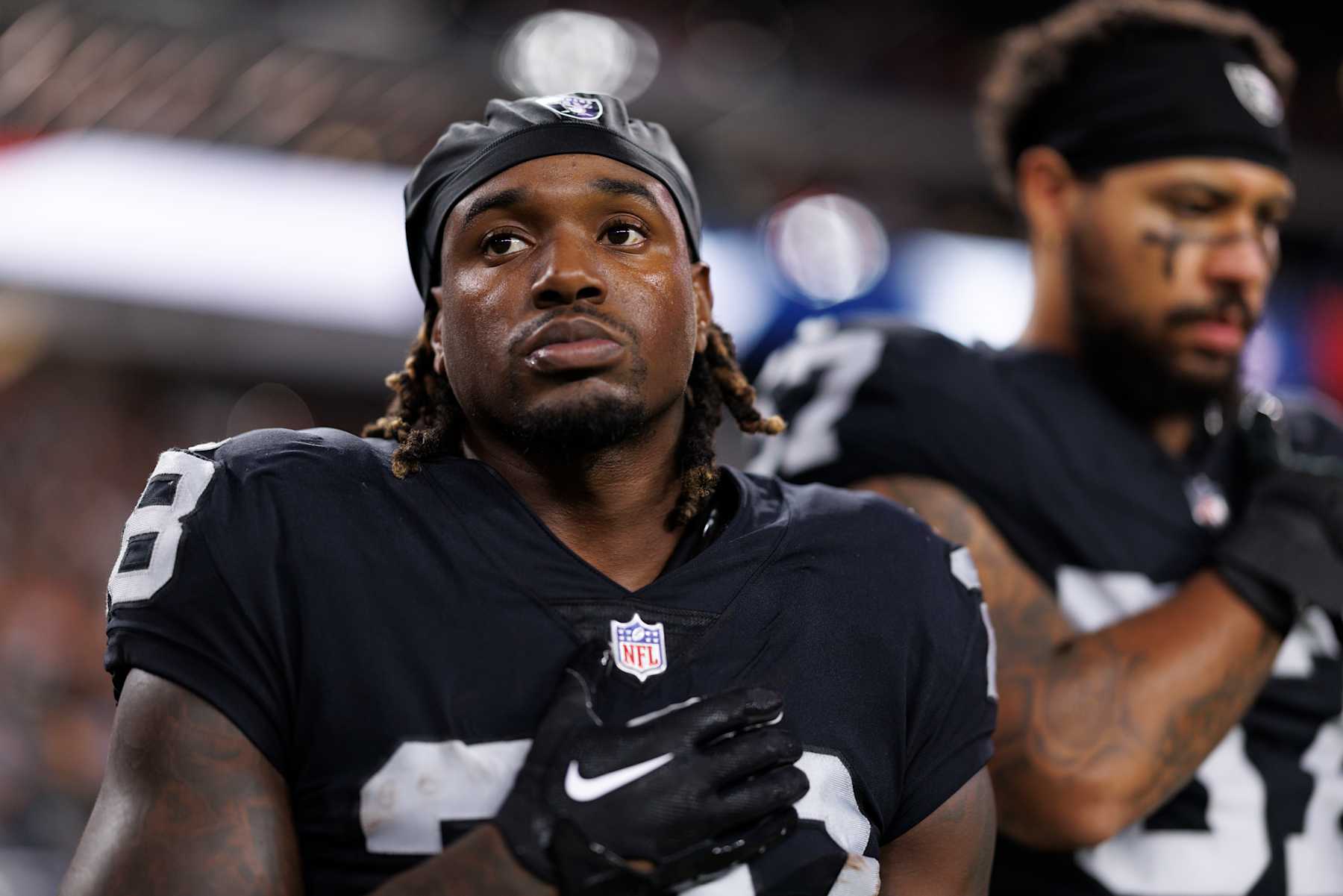 LAS VEGAS, NV - AUGUST 23: Running back Sincere McCormick #28 of the Las Vegas Raiders stands on the sidelines during the national anthem prior to an NFL preseason football game against the San Francisco 49ers, at Allegiant Stadium on August 23, 2024 in Las Vegas, Nevada. (Photo by Brooke Sutton/Getty Images)