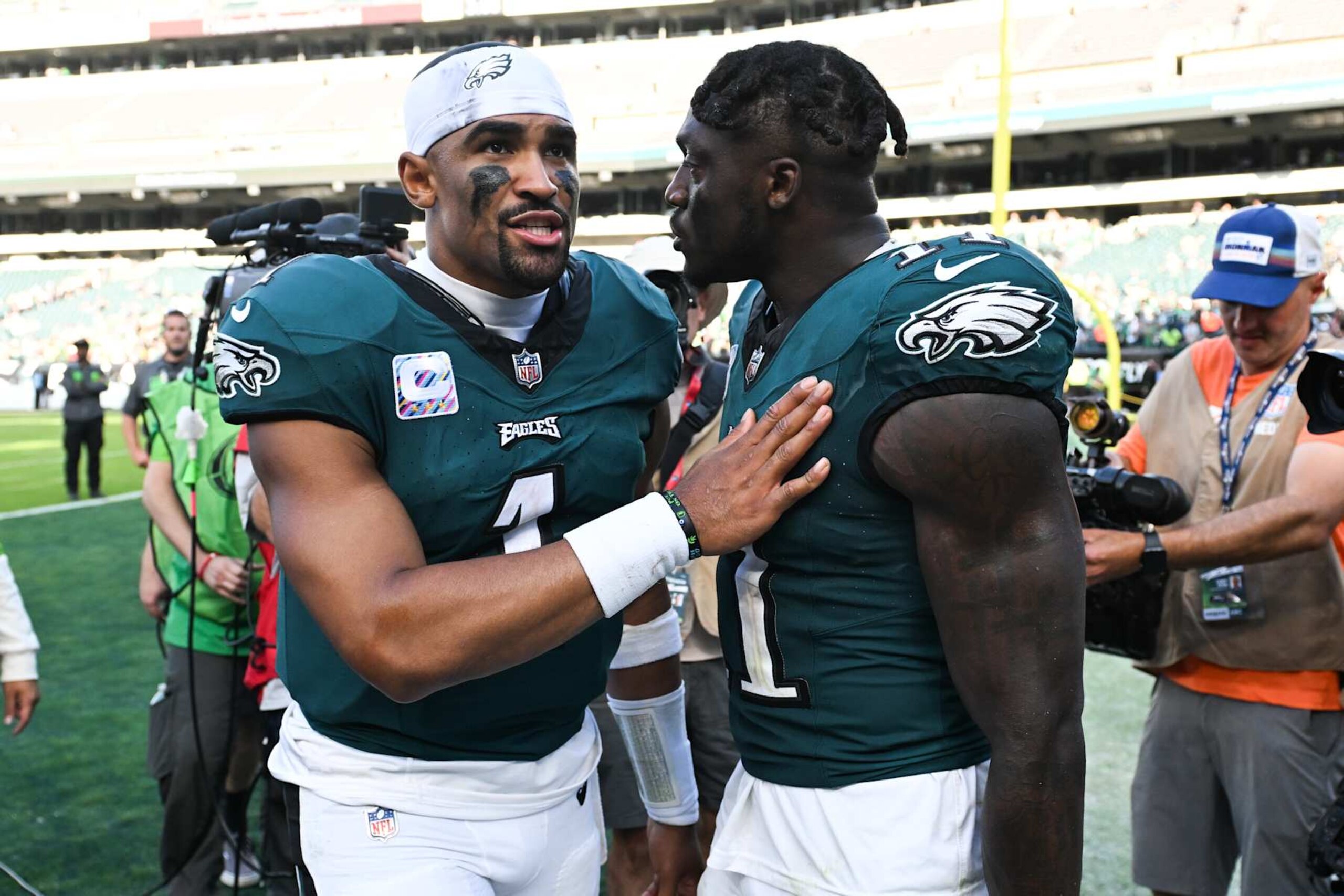 PHILADELPHIA, PA - OCTOBER 01: Jalen Hurts #1 meets with A.J. Brown #11 of the Philadelphia Eagles following an overtime win against the Washington Commanders at Lincoln Financial Field on October 1, 2023 in Philadelphia, Pennsylvania. (Photo by Kathryn Riley/Getty Images) PHILADELPHIA, PA - OCTOBER 01: Jalen Hurts #1 meets with A.J. Brown #11 of the Philadelphia Eagles following an overtime win against the Washington Commanders at Lincoln Financial Field on October 1, 2023 in Philadelphia, Pennsylvania. (Photo by Kathryn Riley/Getty Images)