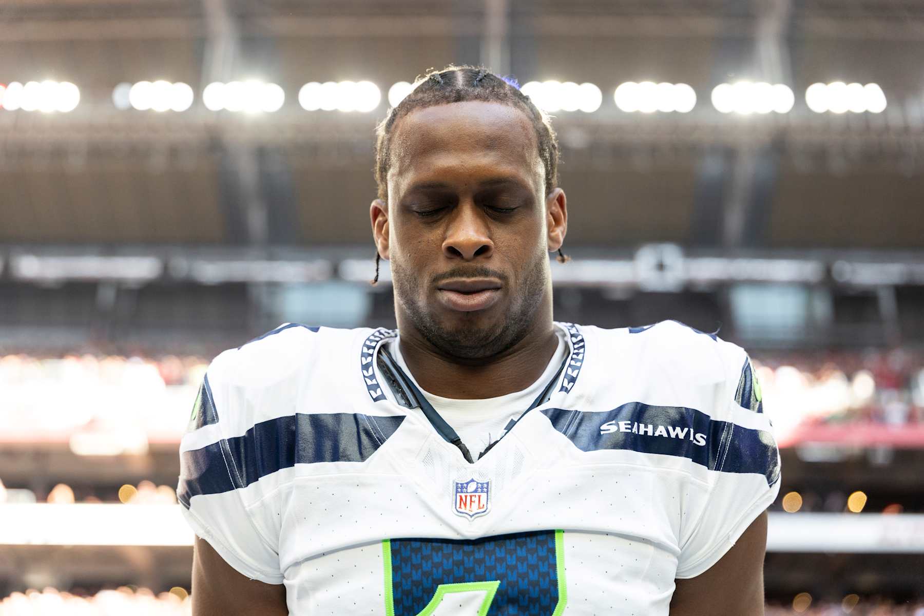 GLENDALE, ARIZONA - DECEMBER 8: Geno Smith #7 of the Seattle Seahawks looks on during the national anthem prior to an NFL Football game against the Arizona Cardinals at State Farm Stadium on December 08, 2024 in Glendale, Arizona. (Photo by Michael Owens/Getty Images)