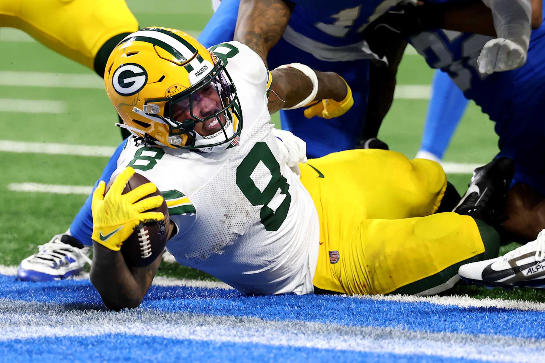 DETROIT, MICHIGAN - DECEMBER 05: Josh Jacobs #8 of the Green Bay Packers scores a 6 yard touchdown against the Detroit Lions during the third quarter in the game at Ford Field on December 05, 2024 in Detroit, Michigan. (Photo by Gregory Shamus/Getty Images)