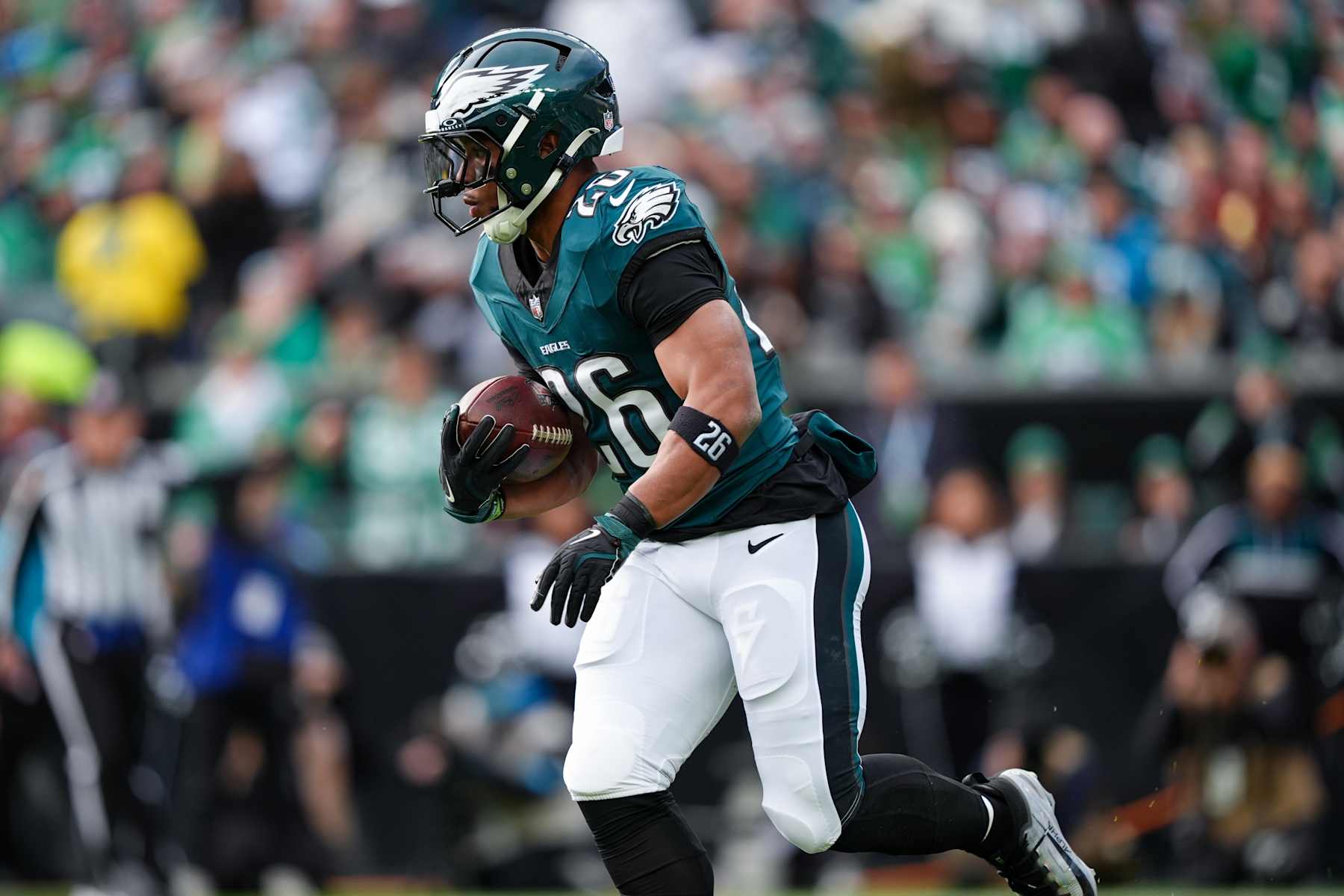 PHILADELPHIA, PA - DECEMBER 08: Philadelphia Eagles running back Saquon Barkley (26) carries the ball in the first half during the game between the Carolina Panthers and Philadelphia Eagles on December 08, 2024 at Lincoln Financial Field in Philadelphia, PA. (Photo by Kyle Ross/Icon Sportswire via Getty Images)