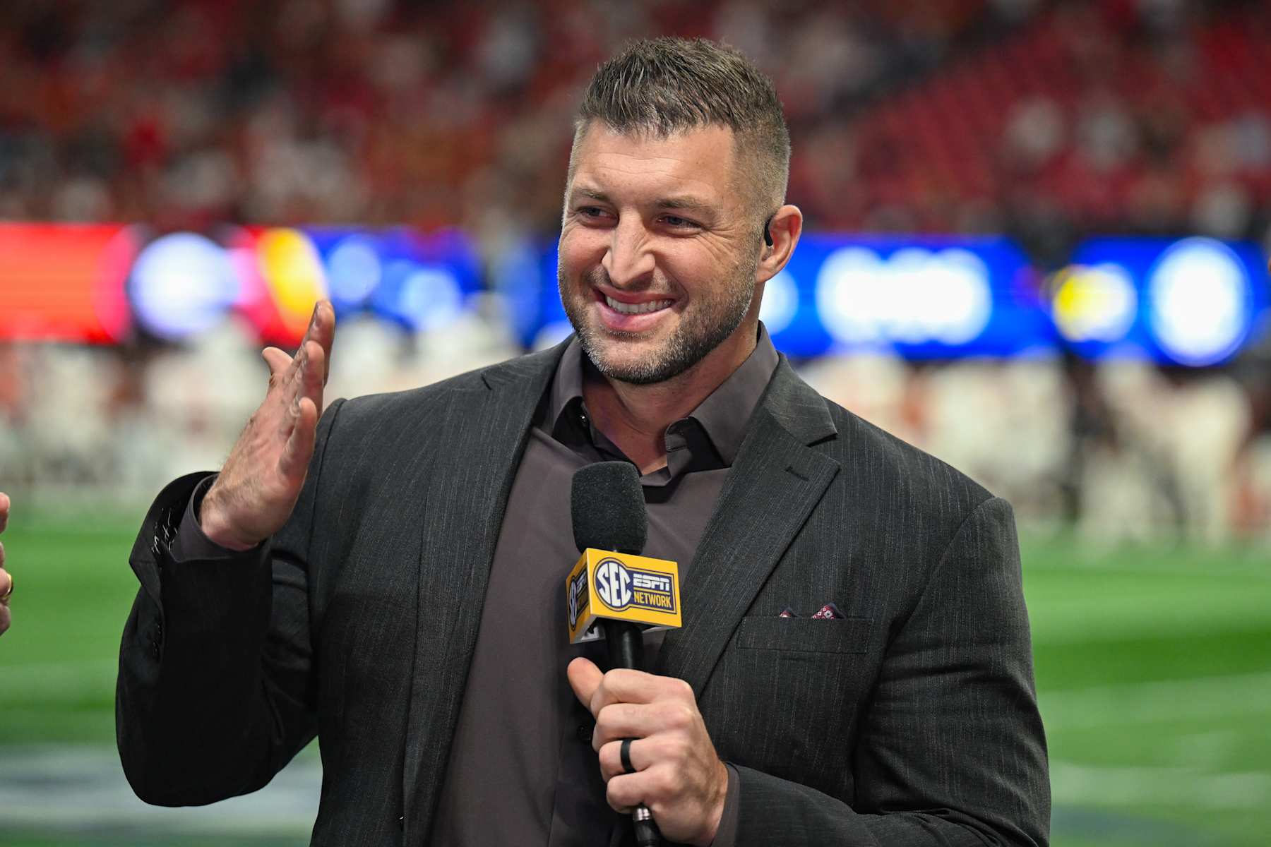 ATLANTA, GA  DECEMBER 07:  Former college and NFL player Tim Tebow reacts prior to the start of the SEC Championship Game between the Texas Longhorns and the Georgia Bulldogs on December 7th, 2024 at Mercedes-Benz Stadium in Atlanta, GA.  (Photo by Rich von Biberstein/Icon Sportswire via Getty Images)