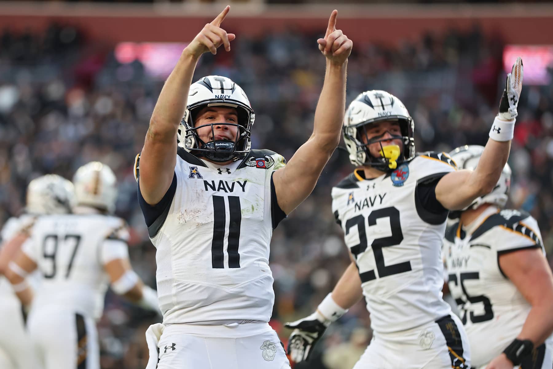 LANDOVER, MARYLAND - DECEMBER 14: Quarterback Blake Horvath #11 of the Navy Midshipmen celebrates after scoring a touchdown against the Army Black Knights during the first quarter of 125th America's Game between the Army Black Knights and the Navy Midshipmen at Northwest Stadium on December 14, 2024 in Landover, Maryland. (Photo by Patrick Smith/Getty Images)