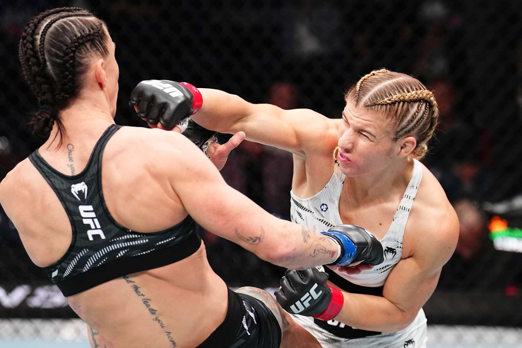 TAMPA, FLORIDA - DECEMBER 14: (R-L) Miranda Maverick punches Jamey-Lyn Horth of Canada in a flyweight fight during the UFC Fight Night event at Amalie Arena on December 14, 2024 in Tampa, Florida. (Photo by Chris Unger/Zuffa LLC)