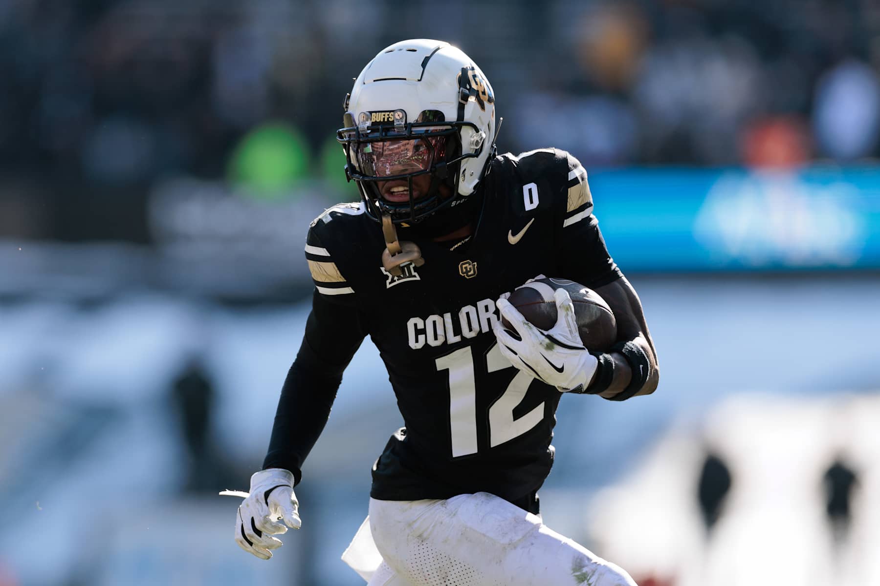 BOULDER, COLORADO - NOVEMBER 29: Travis Hunter #12 of the Colorado Buffaloes runs with the ball during the third quarter against the Oklahoma State Cowboys at Folsom Field on November 29, 2024 in Boulder, Colorado. (Photo by Andrew Wevers/Getty Images)