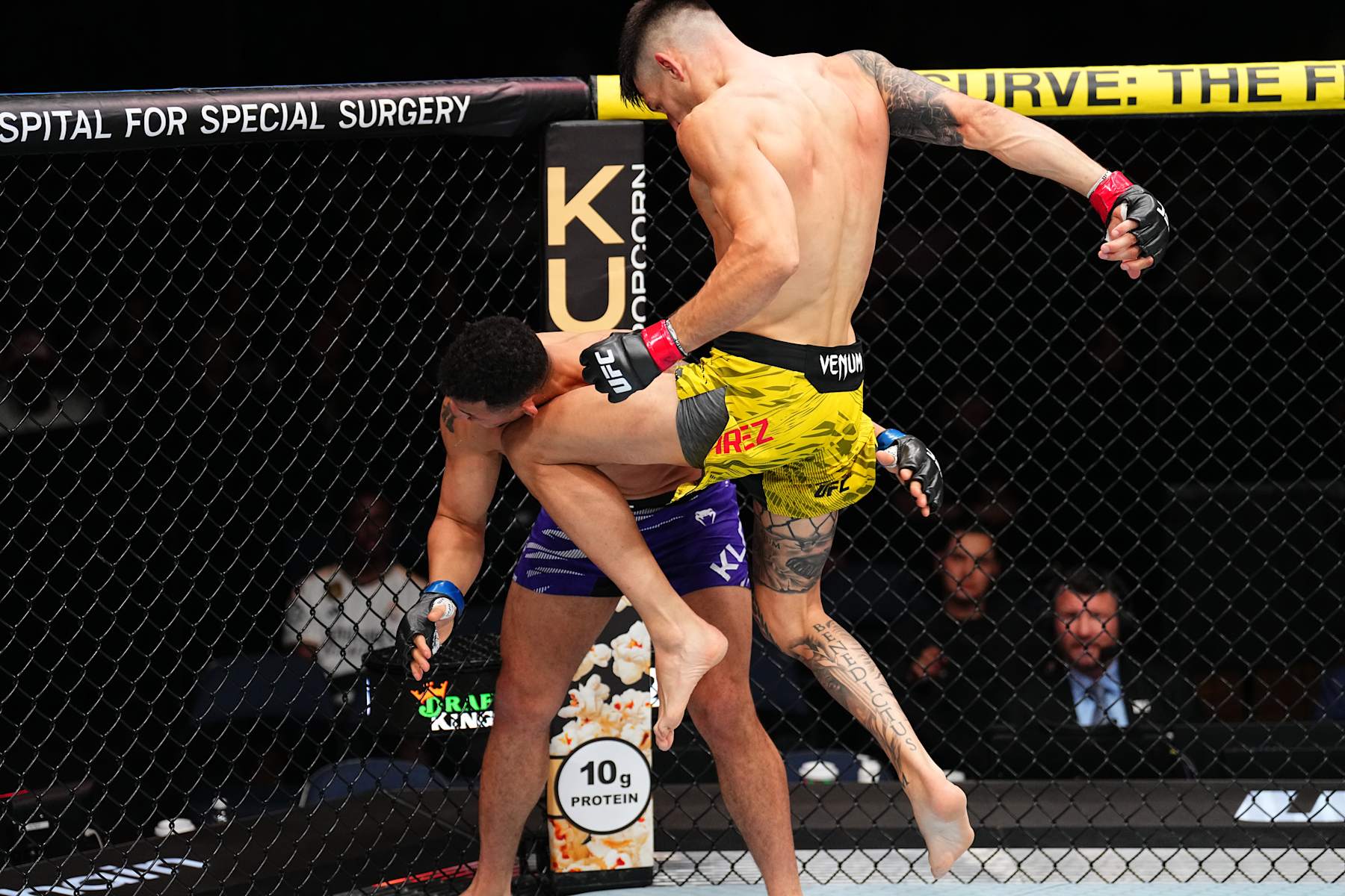 TAMPA, FLORIDA - DECEMBER 14: (R-L) Joel Alvarez of Spain knees Drakkar Klose in a lightweight fight during the UFC Fight Night event at Amalie Arena on December 14, 2024 in Tampa, Florida. (Photo by Chris Unger/Zuffa LLC)
