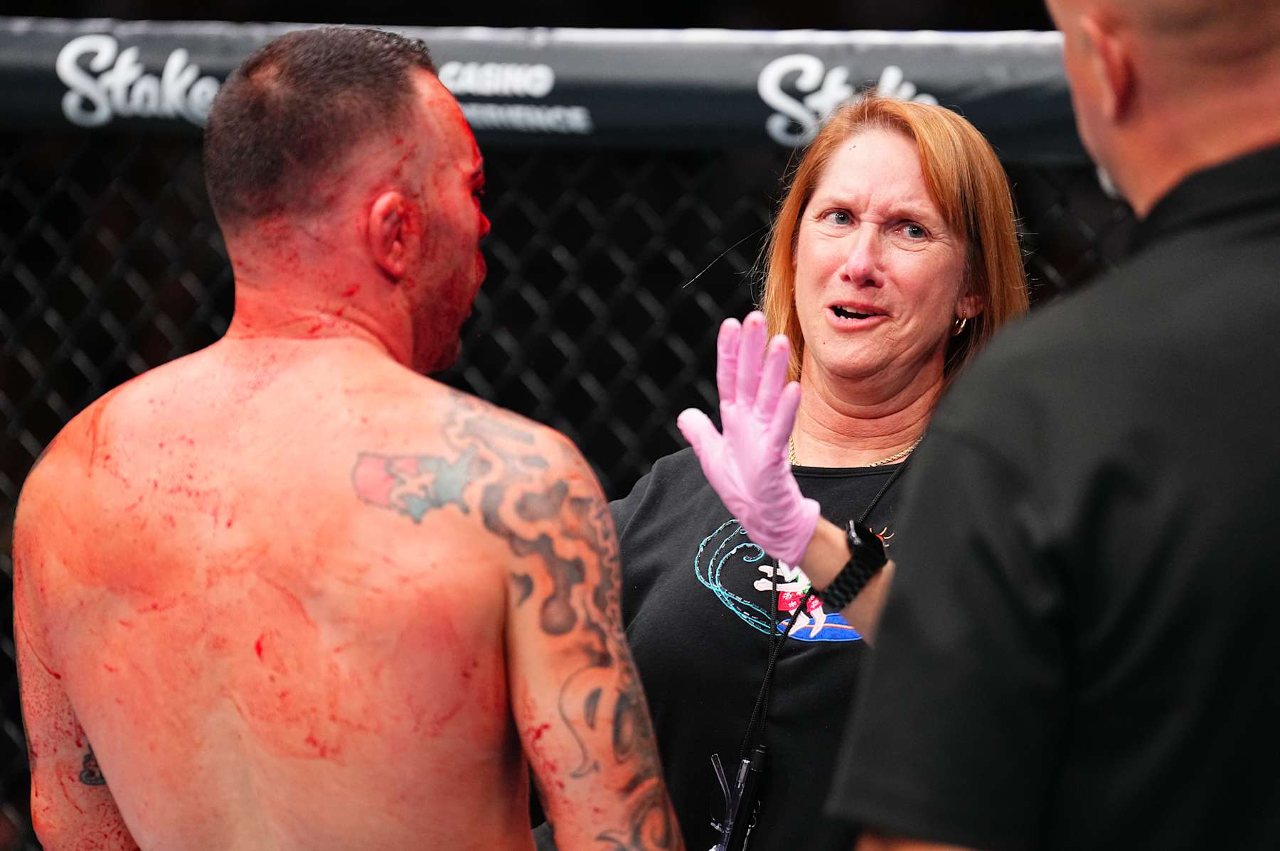 TAMPA, FLORIDA - DECEMBER 14: Colby Covington is checked by the doctor during a welterweight fight against Joaquin Buckley during the UFC Fight Night event at Amalie Arena on December 14, 2024 in Tampa, Florida. (Photo by Chris Unger/Zuffa LLC)