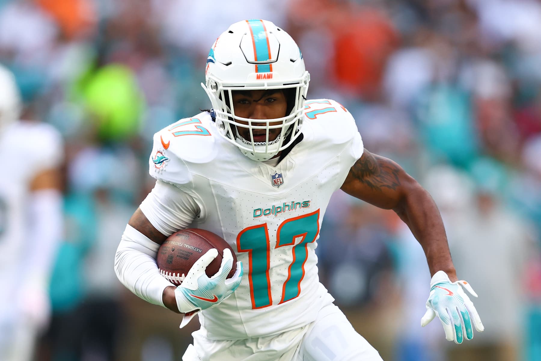 MIAMI GARDENS, FLORIDA - NOVEMBER 24: Jaylen Waddle #17 of the Miami Dolphins carries the ball against the New England Patriots during the first half of the game at Hard Rock Stadium on November 24, 2024 in Miami Gardens, Florida. (Photo by Megan Briggs/Getty Images)