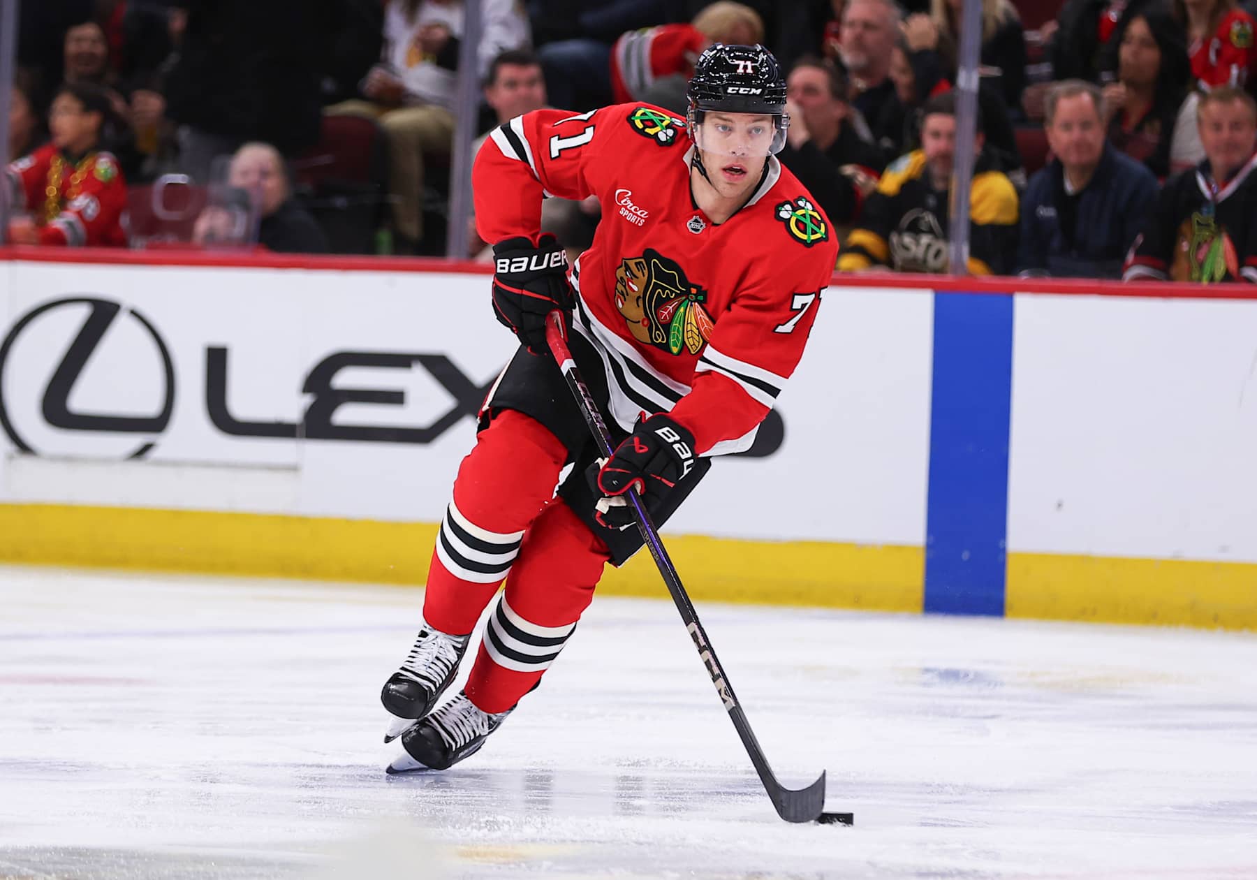 CHICAGO, IL - DECEMBER 04: Taylor Hall #71 of the Chicago Blackhawks brings the puck up ice during the third period against the Boston Bruins on December 4, 2024 at the United Center in Chicago, Illinois. (Photo by Melissa Tamez/Icon Sportswire via Getty Images)