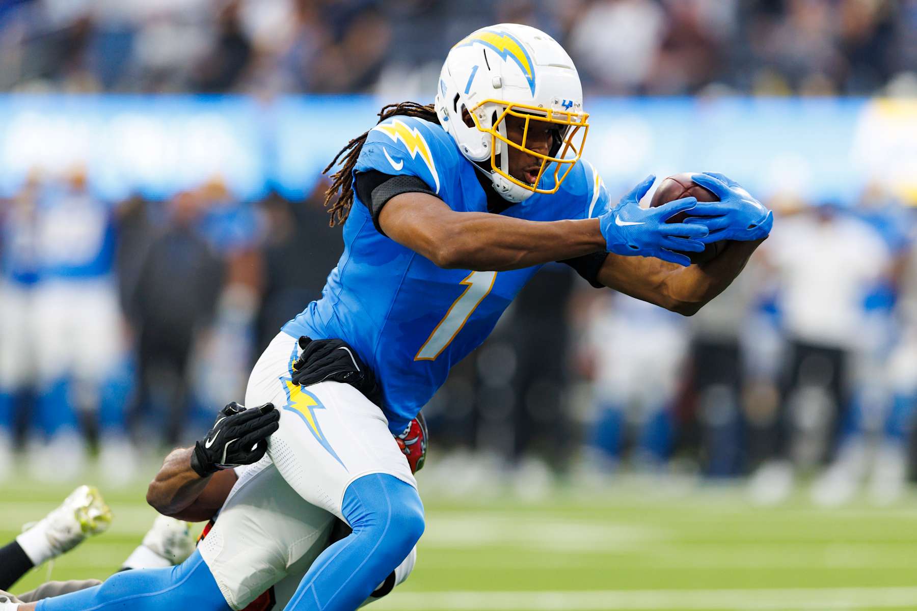 INGLEWOOD, CALIFORNIA - DECEMBER 15: Quentin Johnston #1 of the Los Angeles Chargers dives for the end zone during the first half against the Tampa Bay Buccaneers at SoFi Stadium on December 15, 2024 in Inglewood, California. (Photo by Ric Tapia/Getty Images)