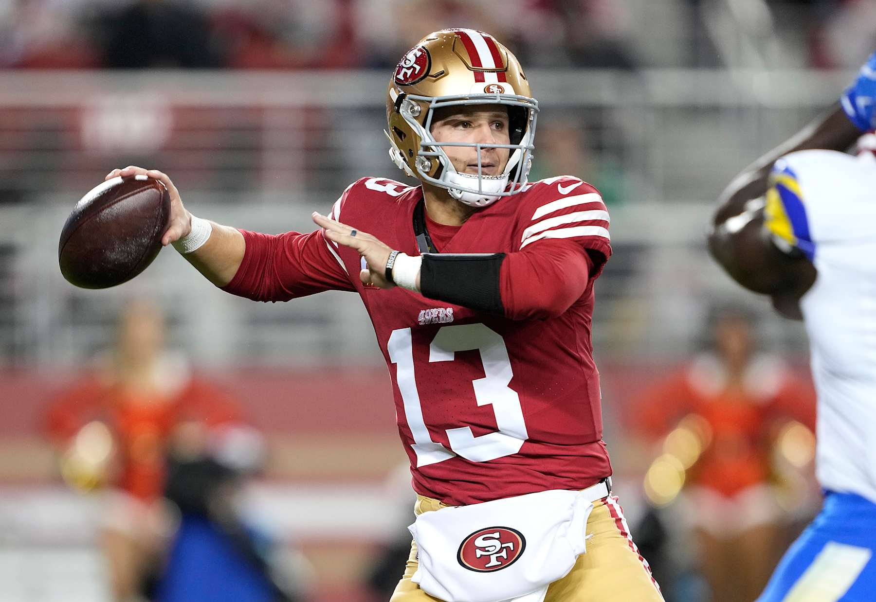 SANTA CLARA, CALIFORNIA - DECEMBER 12: Brock Purdy #13 of the San Francisco 49ers drops back looking to pass against the Los Angeles Rams during the first quarter at Levi's Stadium on December 12, 2024 in Santa Clara, California. (Photo by Thearon W. Henderson/Getty Images)