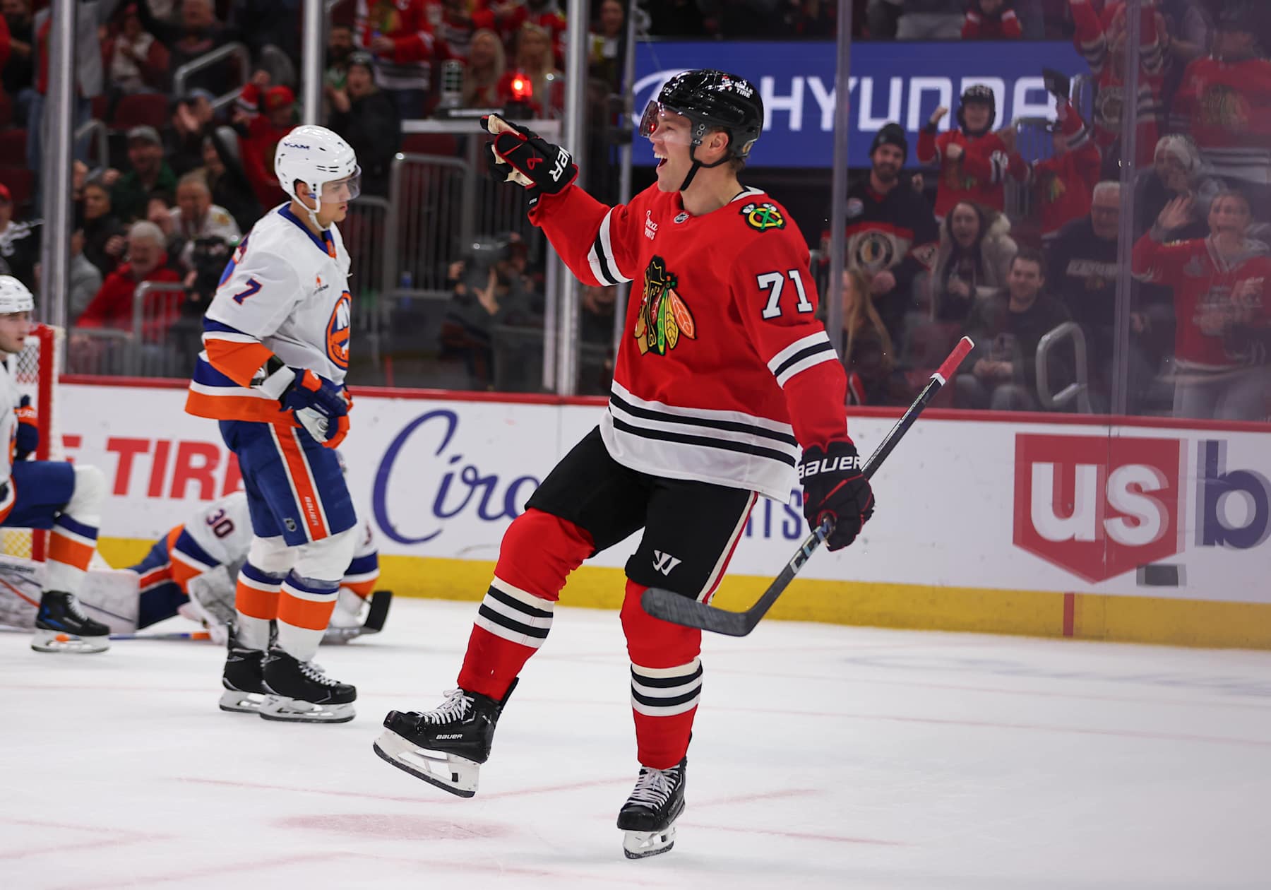 CHICAGO, IL - DECEMBER 15: Taylor Hall #71 of the Chicago Blackhawks celebrates after scoring a goal during the first period against the New York Islanders on December 15, 2024 at the United Center in Chicago, Illinois. (Photo by Melissa Tamez/Icon Sportswire via Getty Images)