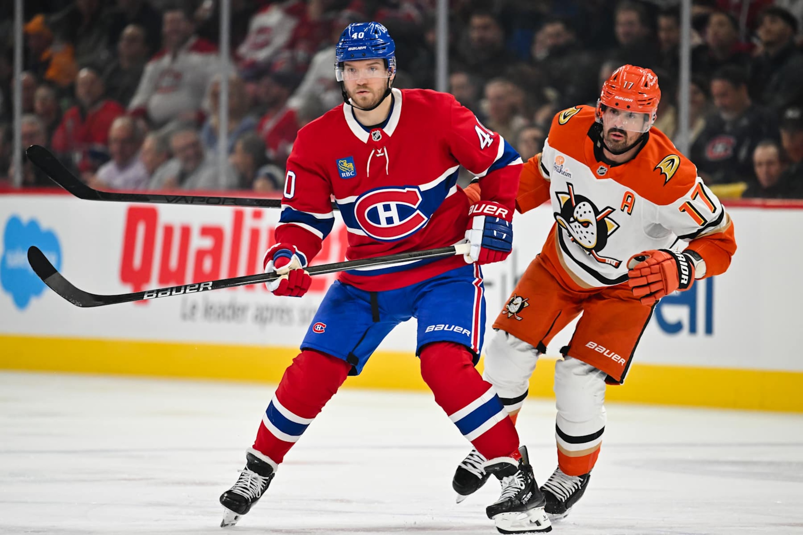 MONTREAL, CANADA - DECEMBER 09:  Joel Armia #40 of the Montreal Canadiens and Alex Killorn #17 of the Anaheim Ducks skate against each other during the first period at the Bell Centre on December 9, 2024 in Montreal, Quebec, Canada.  The Montreal Canadiens defeated the Anaheim Ducks 3-2 in a shootout.  (Photo by Minas Panagiotakis/Getty Images)