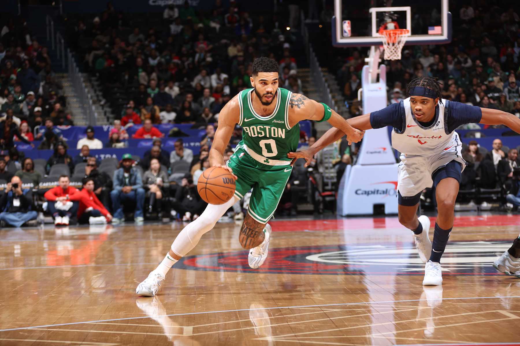 WASHINGTON, DC -  DECEMBER 15:  Jayson Tatum #0 of the Boston Celtics drives to the basket during the game against the Washington Wizards during a regular season game on December 15, 2024 at Capital One Arena in Washington, DC. NOTE TO USER: User expressly acknowledges and agrees that, by downloading and or using this Photograph, user is consenting to the terms and conditions of the Getty Images License Agreement. Mandatory Copyright Notice: Copyright 2024 NBAE (Photo by Kenny Giarla/NBAE via Getty Images)