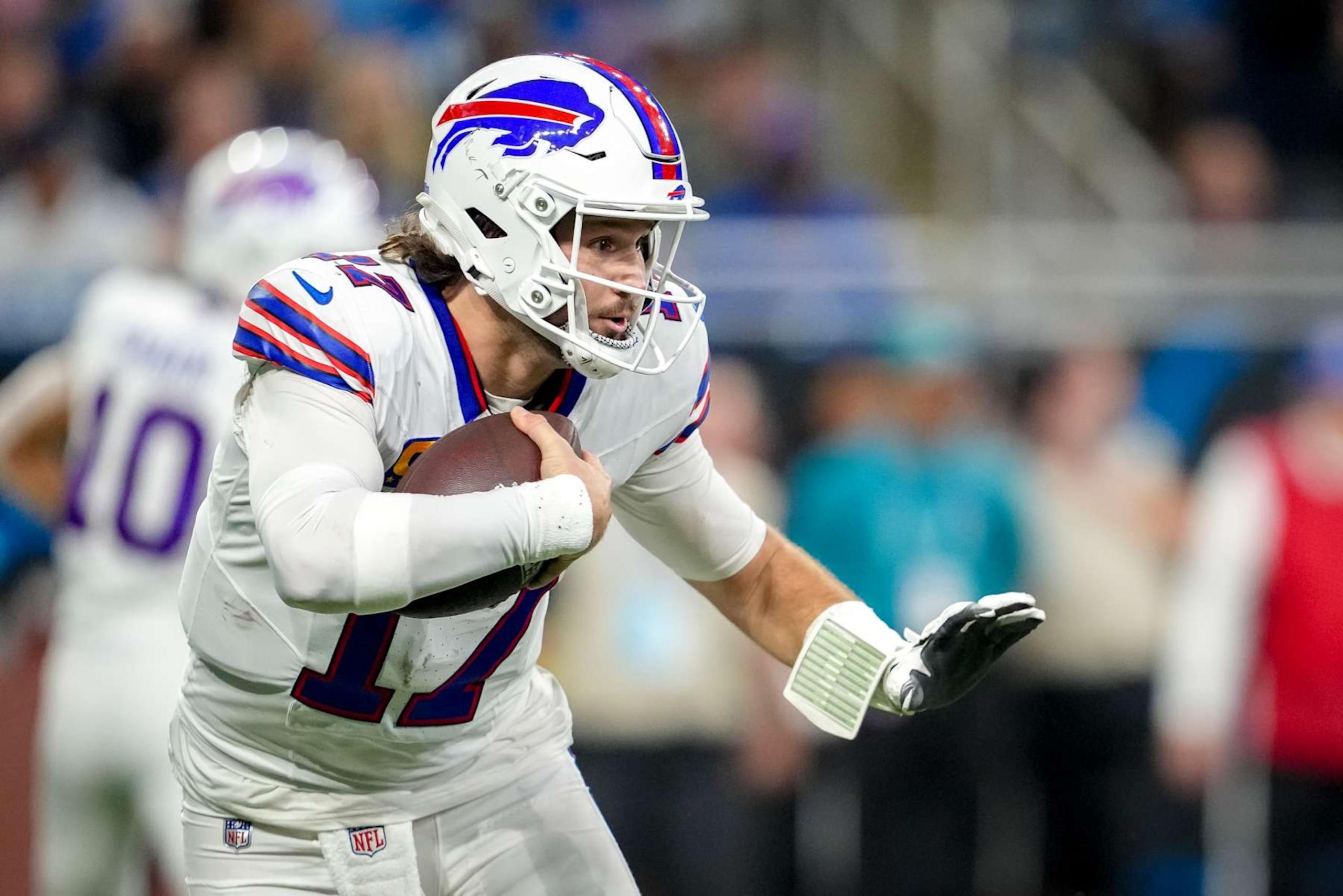 DETROIT, MICHIGAN - DECEMBER 15: Josh Allen #17 of the Buffalo Bills runs in action with the football against the Detroit Lions at Ford Field on December 15, 2024 in Detroit, Michigan. (Photo by Nic Antaya/Getty Images)