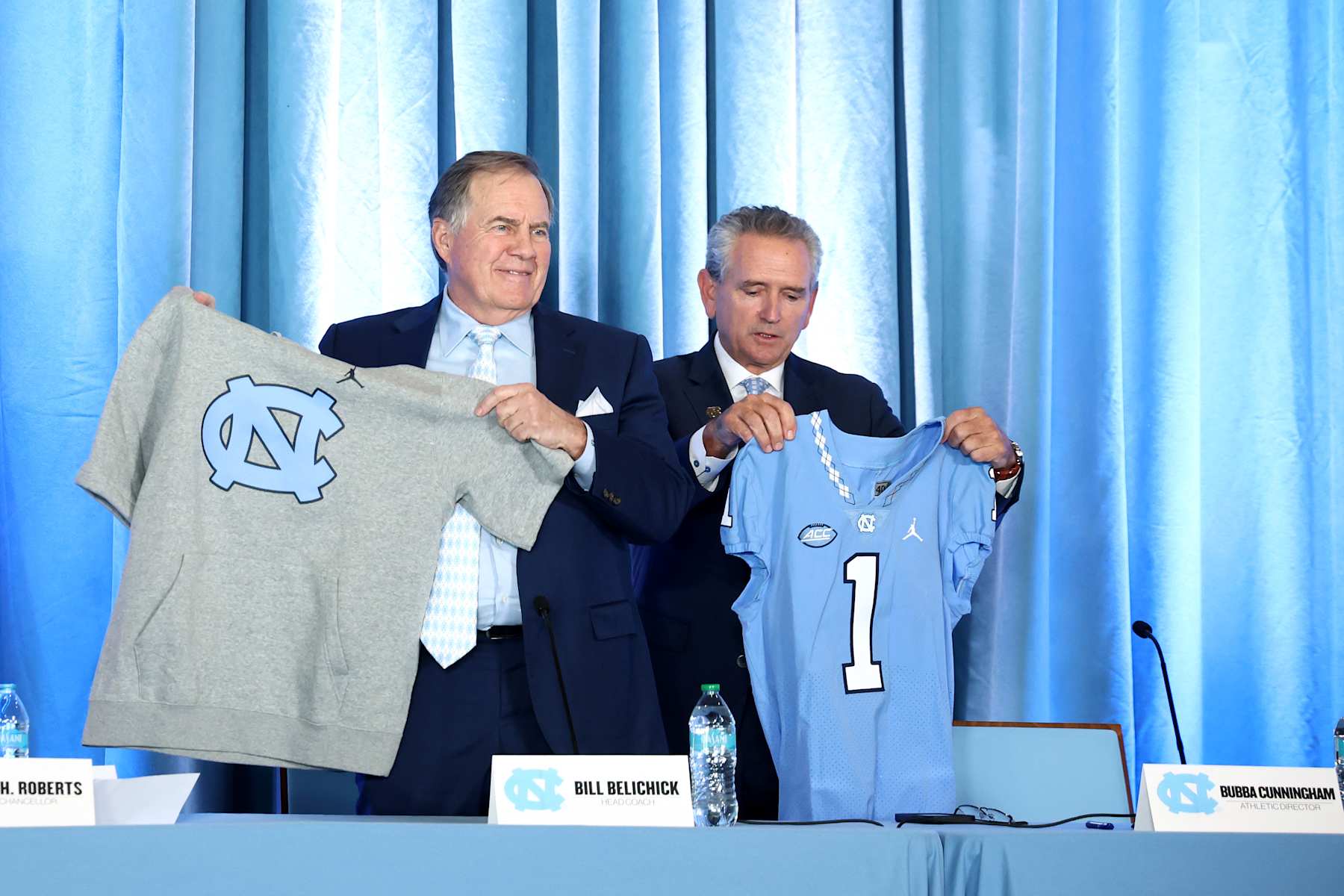 CHAPEL HILL, NORTH CAROLINA - DECEMBER 12: Head Coach Bill Belichick of the North Carolina Tar Heels poses with Athletic director Bubba Cunningham during a press conference on December 12, 2024 in Chapel Hill, North Carolina. (Photo by Jared C. Tilton/Getty Images)
