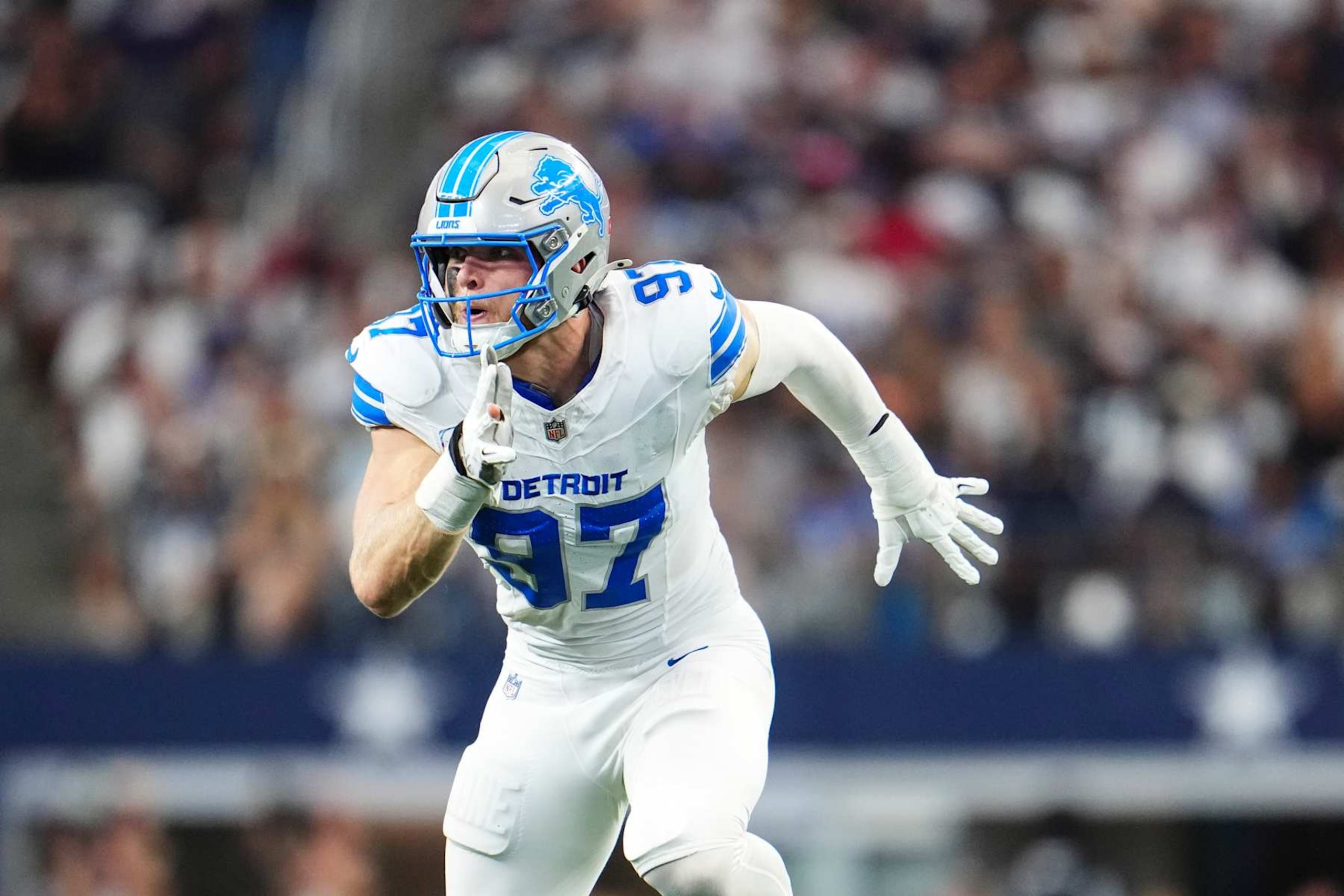 ARLINGTON, TX - OCTOBER 13: Aidan Hutchinson #97 of the Detroit Lions rushes the passer during an NFL football game against the Dallas Cowboys at AT&T Stadium on October 13, 2024 in Arlington, Texas. (Photo by Cooper Neill/Getty Images)