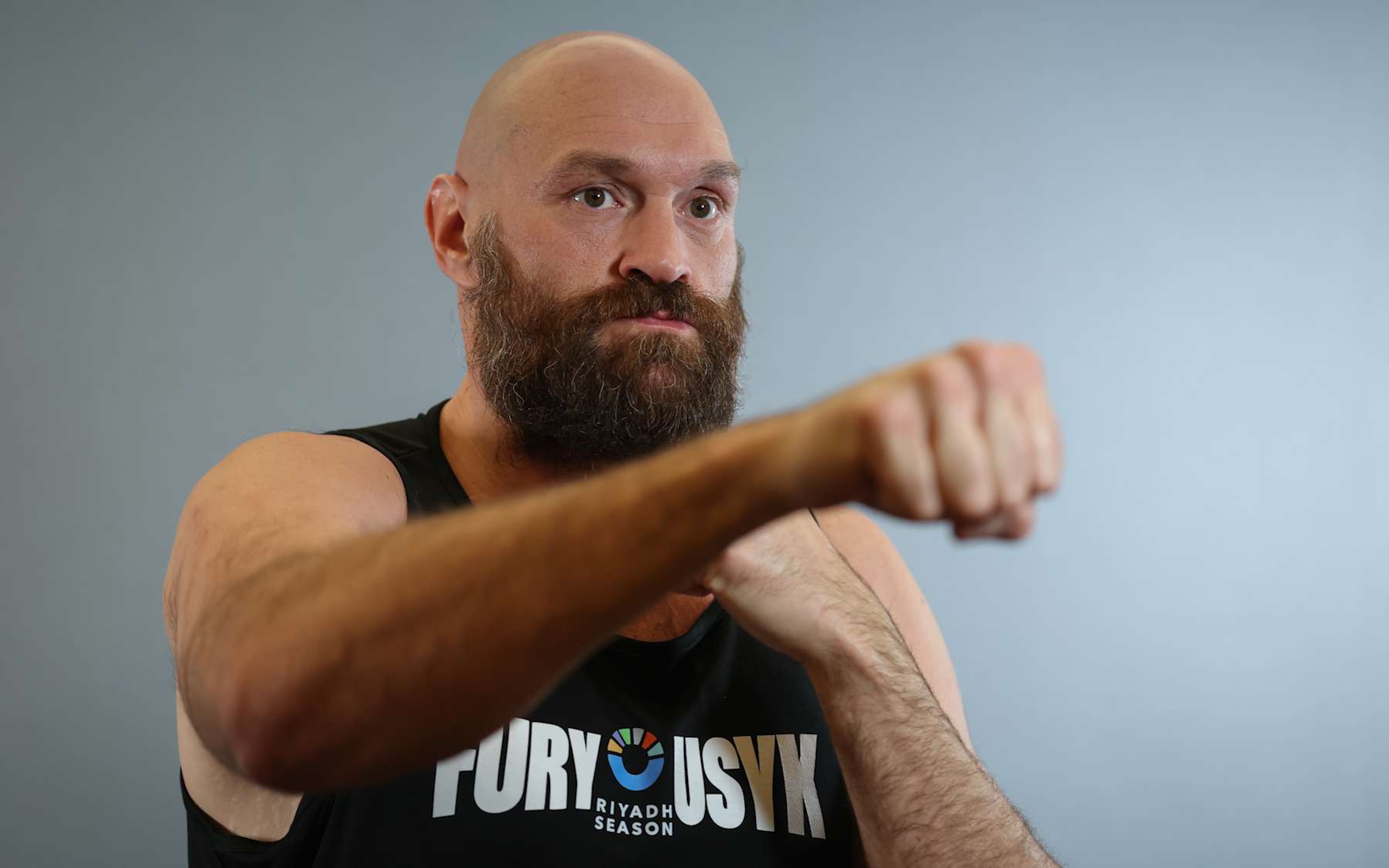 RIYADH, SAUDI ARABIA - DECEMBER 16: Tyson Fury poses for a portrait ahead of the IBF, IBO, WBA, WBC and WBO Undisputed World Heavyweight Title fight between Oleksandr Usyk and Tyson Fury during the media day as part of Oleksandr Usyk v Tyson Fury 2 at the Hilton Residence on December 16, 2024 in Riyadh, Saudi Arabia. (Photo by Richard Pelham/Getty Images) RIYADH, SAUDI ARABIA - DECEMBER 16: Tyson Fury poses for a portrait ahead of the IBF, IBO, WBA, WBC and WBO Undisputed World Heavyweight Title fight between Oleksandr Usyk and Tyson Fury during the media day as part of Oleksandr Usyk v Tyson Fury 2 at the Hilton Residence on December 16, 2024 in Riyadh, Saudi Arabia. (Photo by Richard Pelham/Getty Images)
