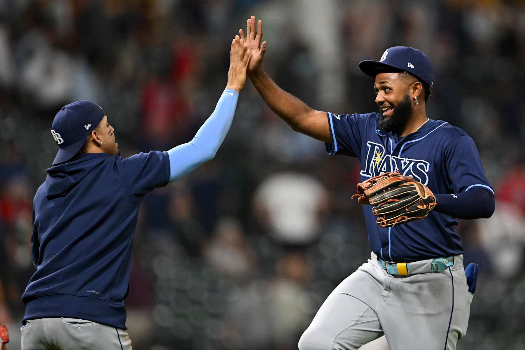 CLEVELAND, OHIO - SEPTEMBER 12: Christopher Morel #24 and Junior Caminero #13 of the Tampa Bay Rays celebrate the team's 5-2 win over the Cleveland Guardians at Progressive Field on September 12, 2024 in Cleveland, Ohio. (Photo by Nick Cammett/Getty Images)