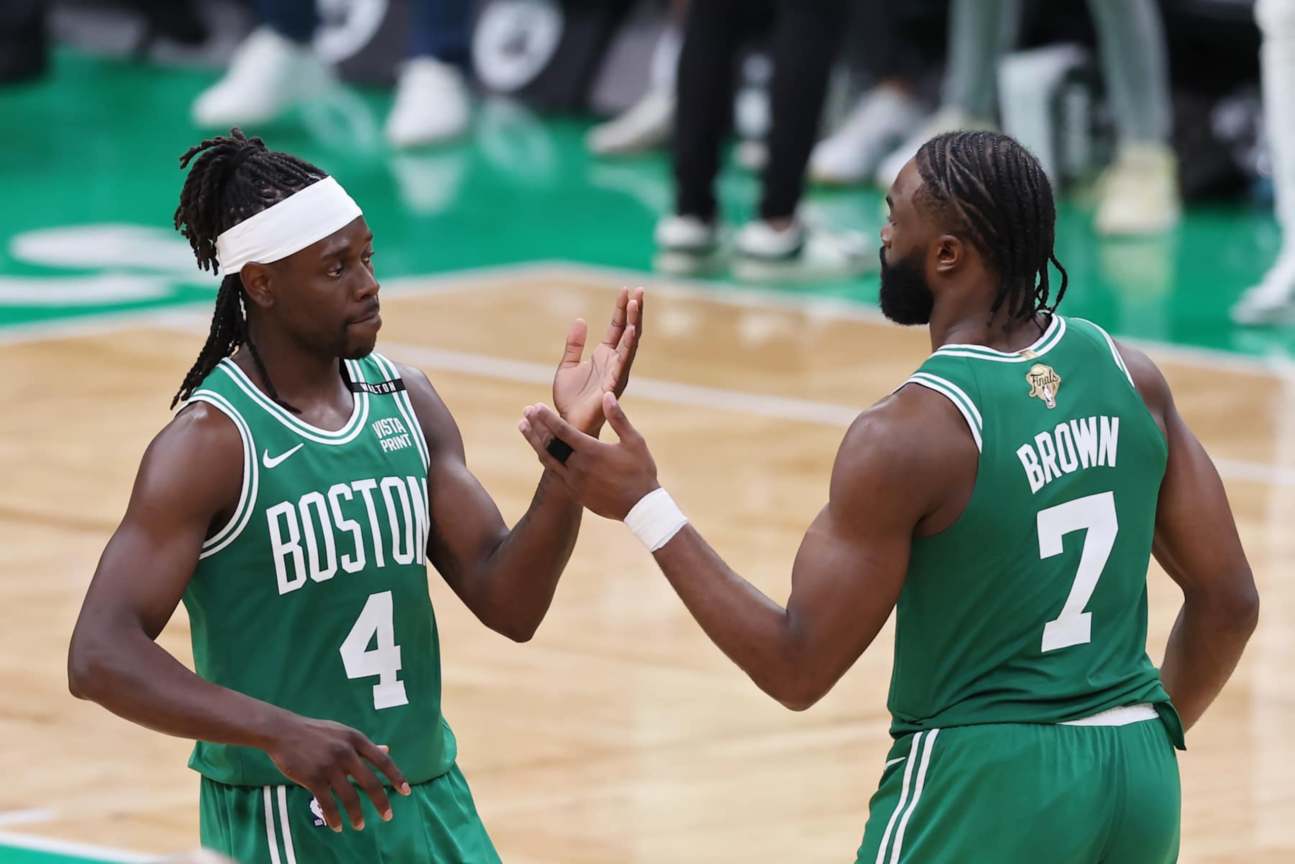BOSTON, MASSACHUSETTS - JUNE 17: Jrue Holiday #4 and Jaylen Brown #7 of the Boston Celtics high five during the third quarter of Game Five of the 2024 NBA Finals against the Dallas Mavericks at TD Garden on June 17, 2024 in Boston, Massachusetts. NOTE TO USER: User expressly acknowledges and agrees that, by downloading and or using this photograph, User is consenting to the terms and conditions of the Getty Images License Agreement. (Photo by Adam Glanzman/Getty Images)