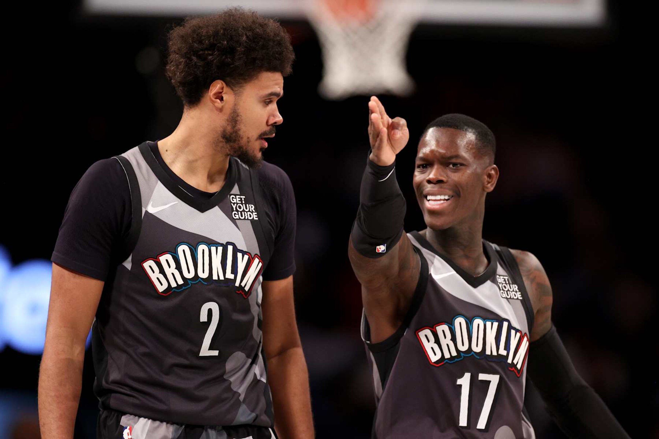 NEW YORK, NEW YORK - DECEMBER 01: Dennis Schroder #17  and Cameron Johnson #2 of the Brooklyn Nets react against the Orlando Magic during the second half at Barclays Center on December 01, 2024 in New York City. NOTE TO USER: User expressly acknowledges and agrees that, by downloading and or using this photograph, User is consenting to the terms and conditions of the Getty Images License Agreement. (Photo by Evan Bernstein/Getty Images)