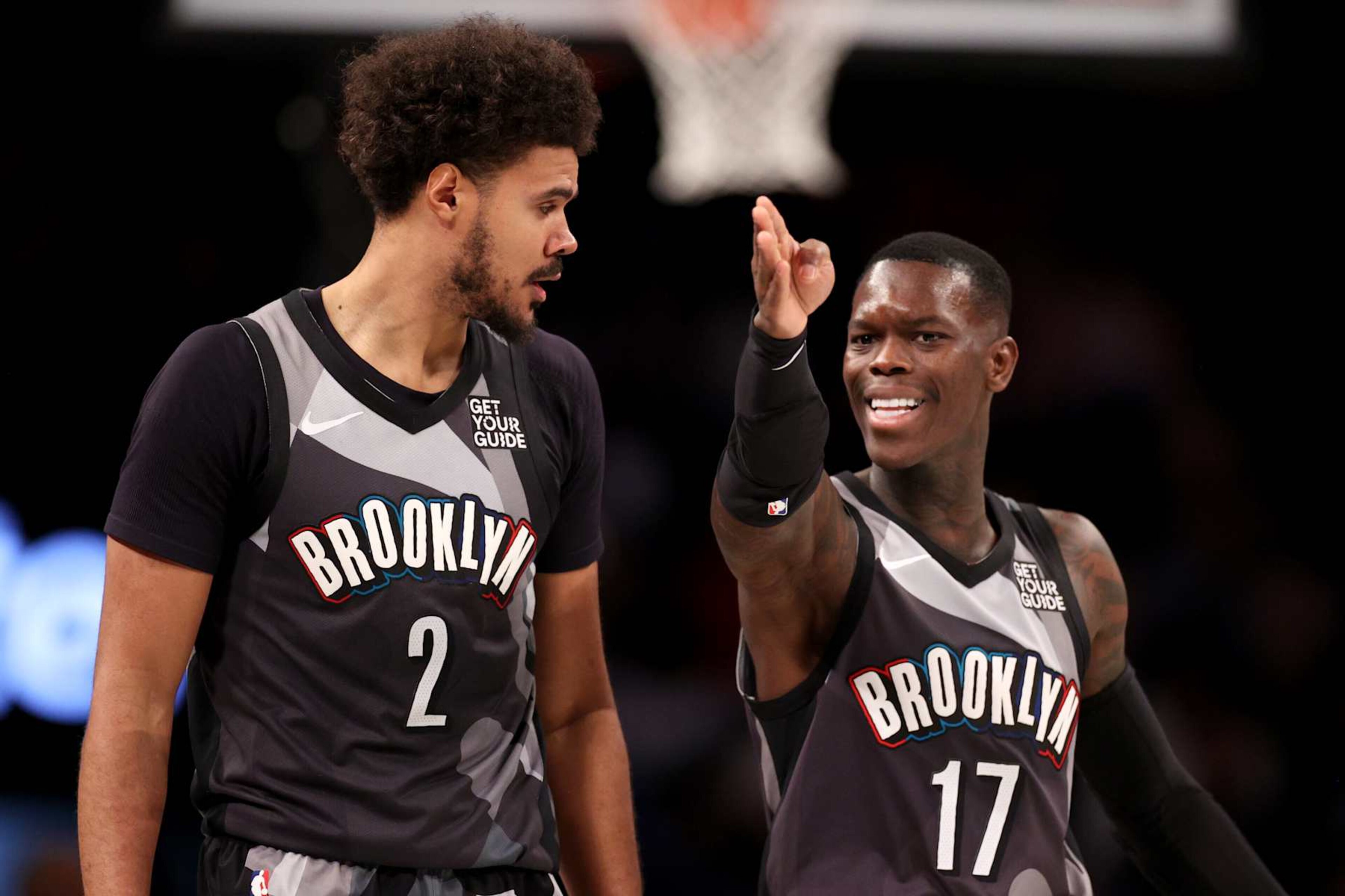 NEW YORK, NEW YORK - DECEMBER 01: Dennis Schroder #17  and Cameron Johnson #2 of the Brooklyn Nets react against the Orlando Magic during the second half at Barclays Center on December 01, 2024 in New York City. NOTE TO USER: User expressly acknowledges and agrees that, by downloading and or using this photograph, User is consenting to the terms and conditions of the Getty Images License Agreement. (Photo by Evan Bernstein/Getty Images)