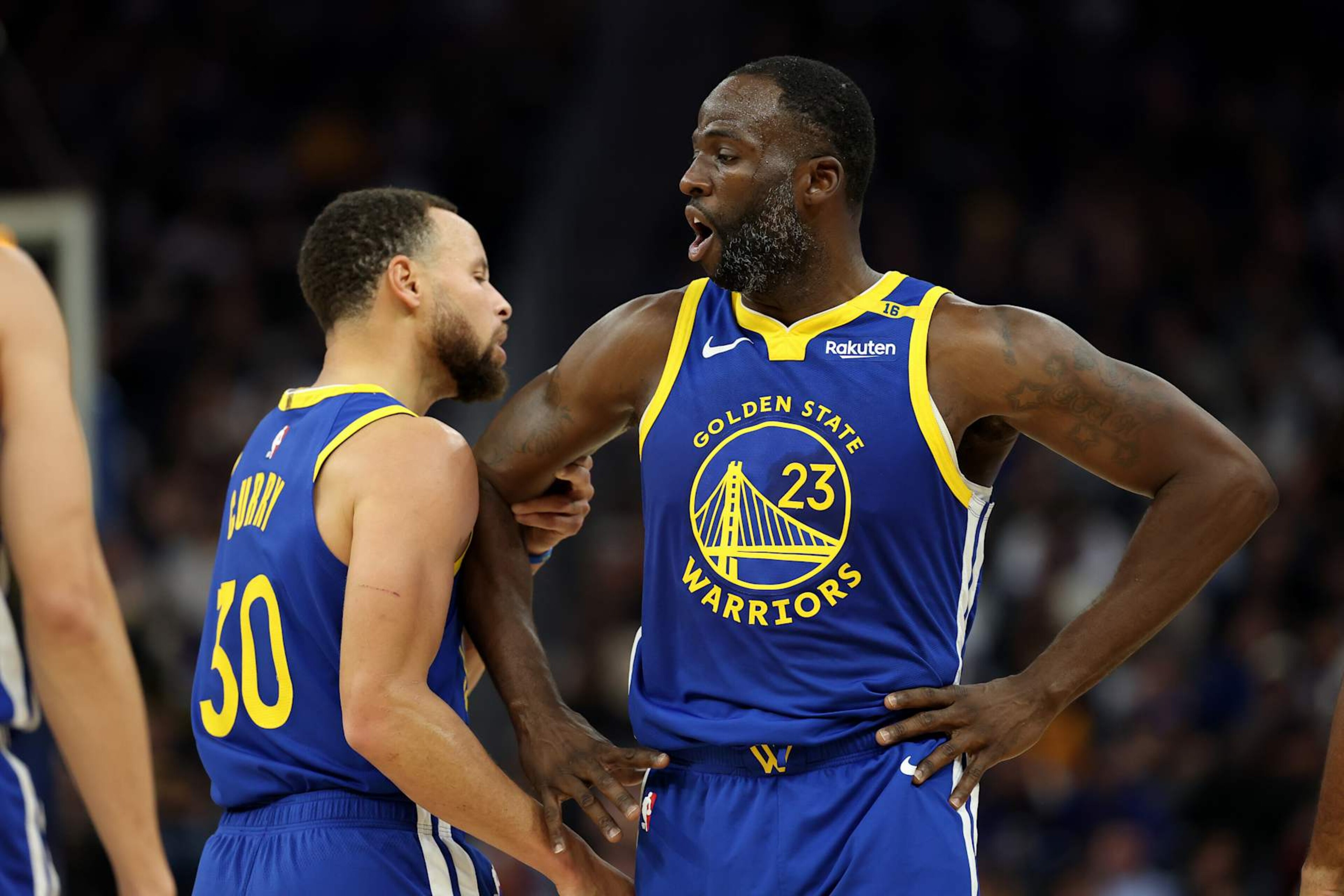 SAN FRANCISCO, CALIFORNIA - DECEMBER 06: Stephen Curry #30 holds back Draymond Green #23 of the Golden State Warriors after Green got called for a technical foul against the Minnesota Timberwolves in the first half at Chase Center on December 06, 2024 in San Francisco, California. NOTE TO USER: User expressly acknowledges and agrees that, by downloading and/or using this photograph, user is consenting to the terms and conditions of the Getty Images License Agreement.   (Photo by Ezra Shaw/Getty Images)