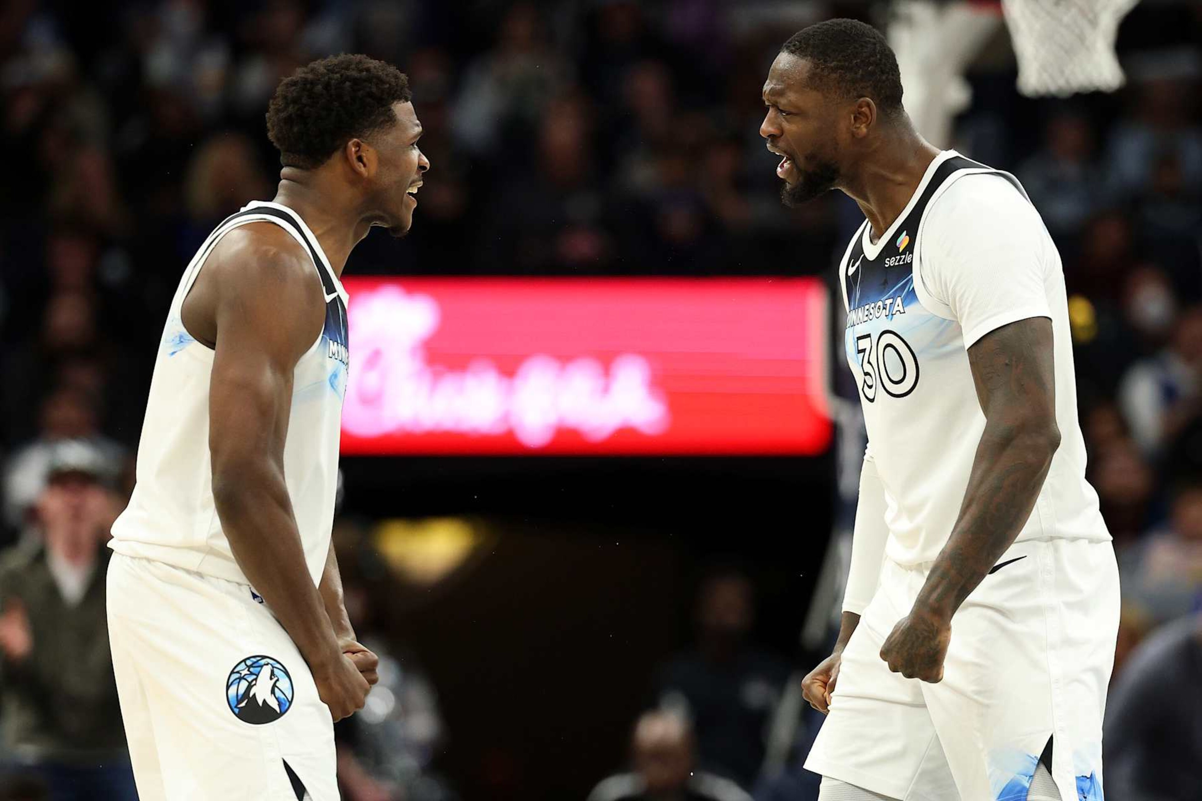 MINNEAPOLIS, MINNESOTA - NOVEMBER 27: Julius Randle #30 celebrates with Anthony Edwards #5 of the Minnesota Timberwolves in the fourth quarter against the Sacramento Kings at Target Center on November 27, 2024 in Minneapolis, Minnesota. The Kings defeated the Timberwolves 115-104. NOTE TO USER: User expressly acknowledges and agrees that, by downloading and or using this photograph, User is consenting to the terms and conditions of the Getty Images License Agreement. (Photo by David Berding/Getty Images)