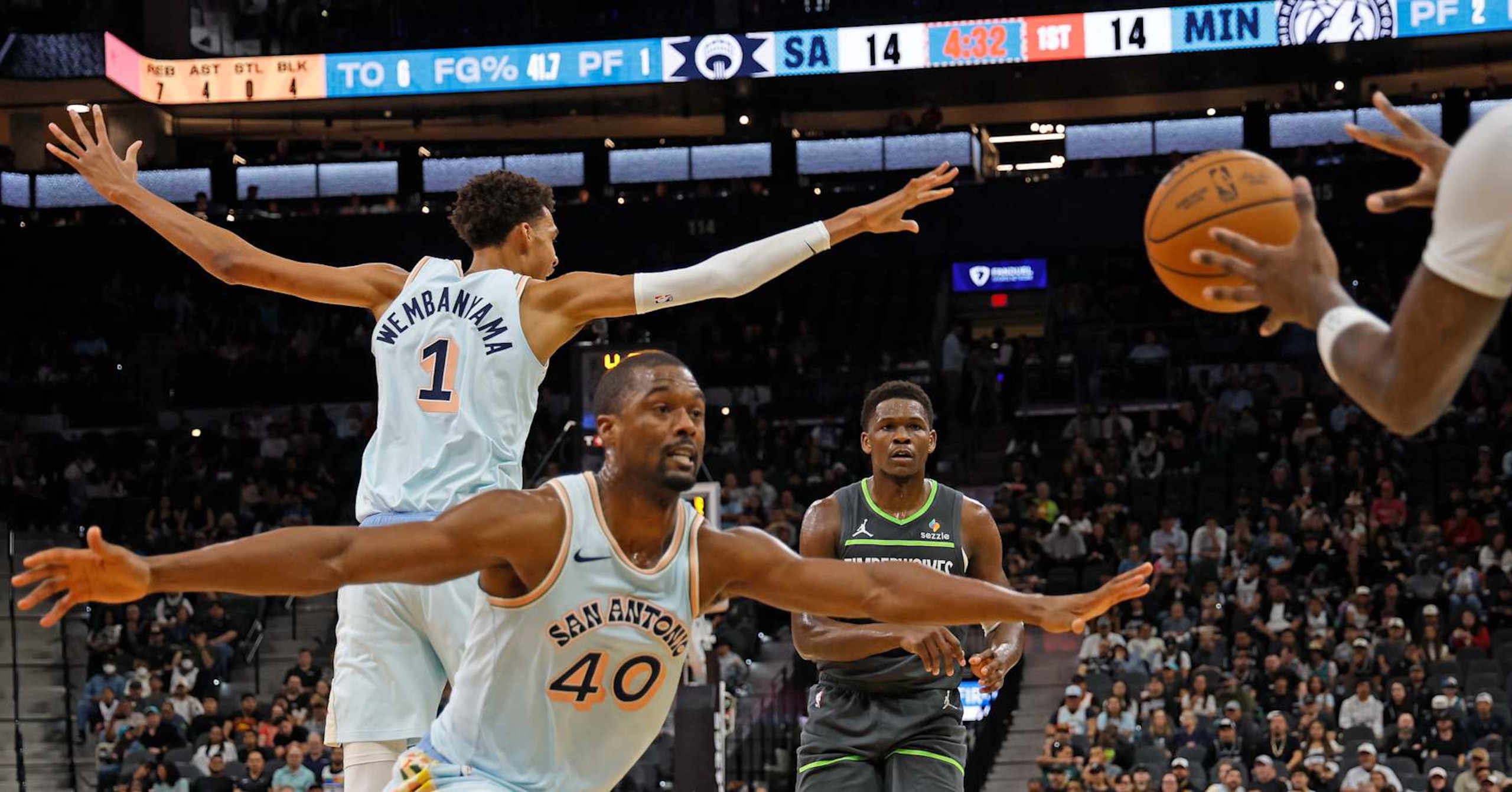 SAN ANTONIO, TX - DECEMBER 15: Harrison Barnes #40 of the San Antonio Spurs and Victor Wembanyama #1 of the San Antonio Spurs attempt to stop a pass from the Minnesota Timberwolves in the first half at Frost Bank Center on December 15, 2024 in San Antonio, Texas. NOTE TO USER: User expressly acknowledges and agrees that, by downloading and or using this photograph, User is consenting to terms and conditions of the Getty Images License Agreement. (Photo by Ronald Cortes/Getty Images)
