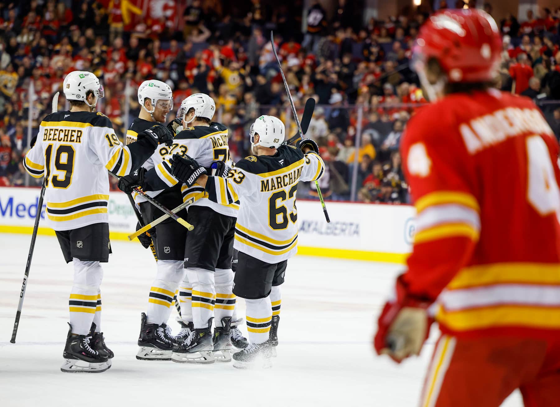 CALGARY, CANADA - DECEMBER 17: Nikita Zadorov #91of the Boston Bruins, Charlie McAvoy #73 of the Boston Bruins, Brad Marchand #63 of the Boston Bruins and John Beecher #19 of the Boston Bruins celebrate their overtime win 4-3 against the Calgary Flames at the Scotiabank Saddledome on December 17, 2024, in Calgary, Alberta, Canada. (Photo by Leah Hennel/Getty Images)