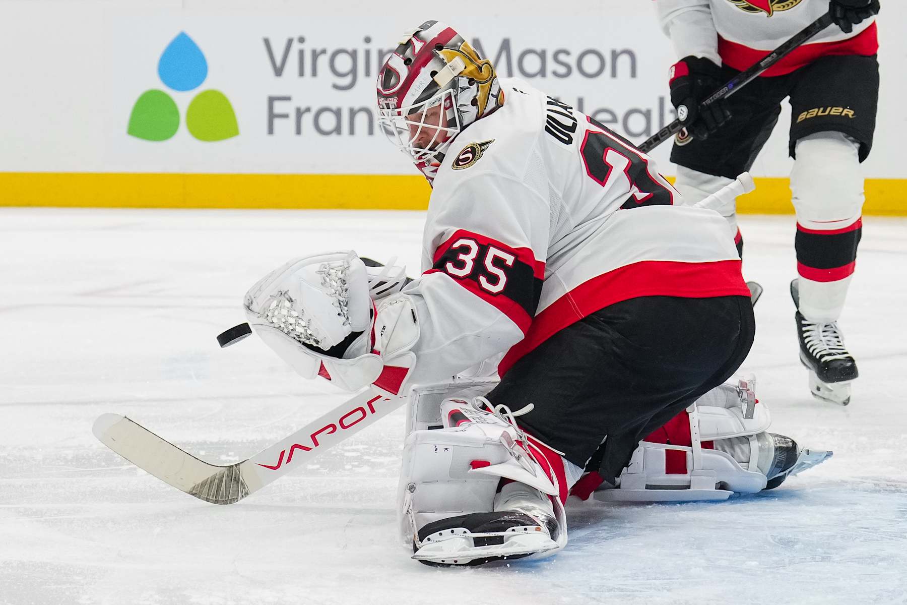 SEATTLE, WASHINGTON - DECEMBER 17: Linus Ullmark #35 of the Ottawa Senators moves to block a shot during the first period of a game against the Seattle Kraken at Climate Pledge Arena on December 17, 2024 in Seattle, Washington. (Photo by Christopher Mast/NHLI via Getty Images)