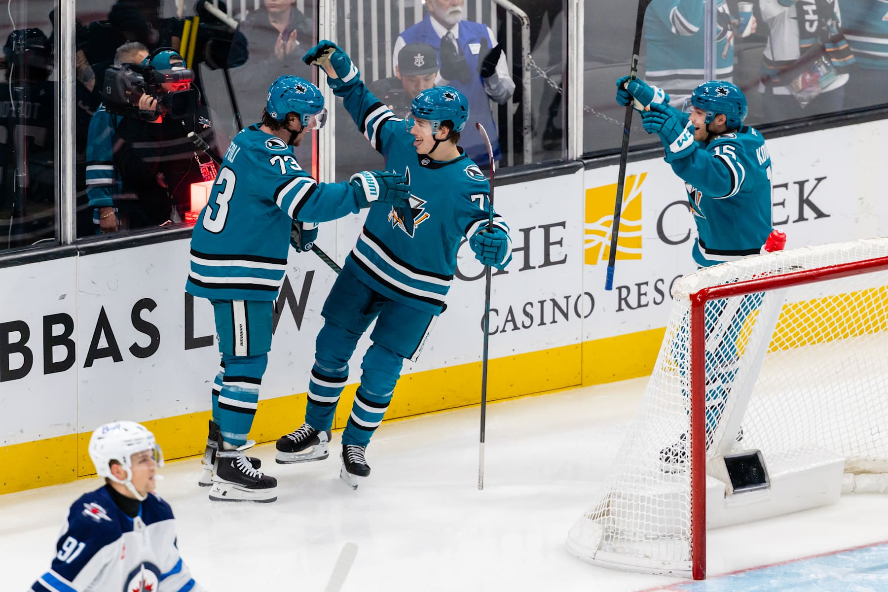 SAN JOSE, CA - DECEMBER 17: San Jose Sharks center Tyler Toffoli (73) celebrates a goal with San Jose Sharks center Macklin Celebrini (71) who had an assist during a NHL game between the Winnipeg Jets and the San Jose Sharks on December 17, 2024 at SAP Center at San Jose in San Jose, CA. (Photo by Matthew Huang/Icon Sportswire via Getty Images)