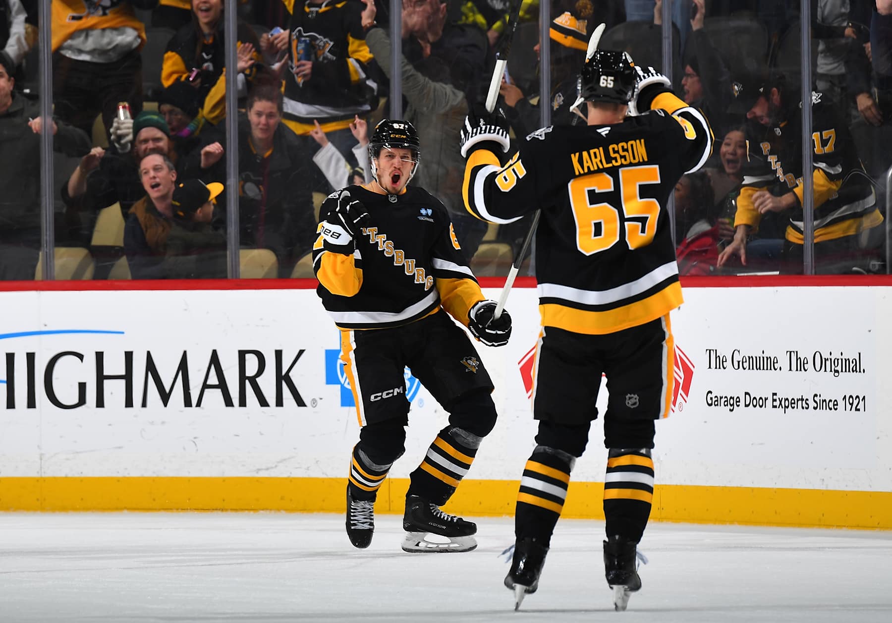 PITTSBURGH, PA - DECEMBER 17: Rickard Rakell #67 celebrates his overtime goal with Erik Karlsson #65 of the Pittsburgh Penguins against the Los Angeles Kings at PPG PAINTS Arena on December 17, 2024 in Pittsburgh, Pennsylvania. (Photo by Joe Sargent/NHLI via Getty Images)