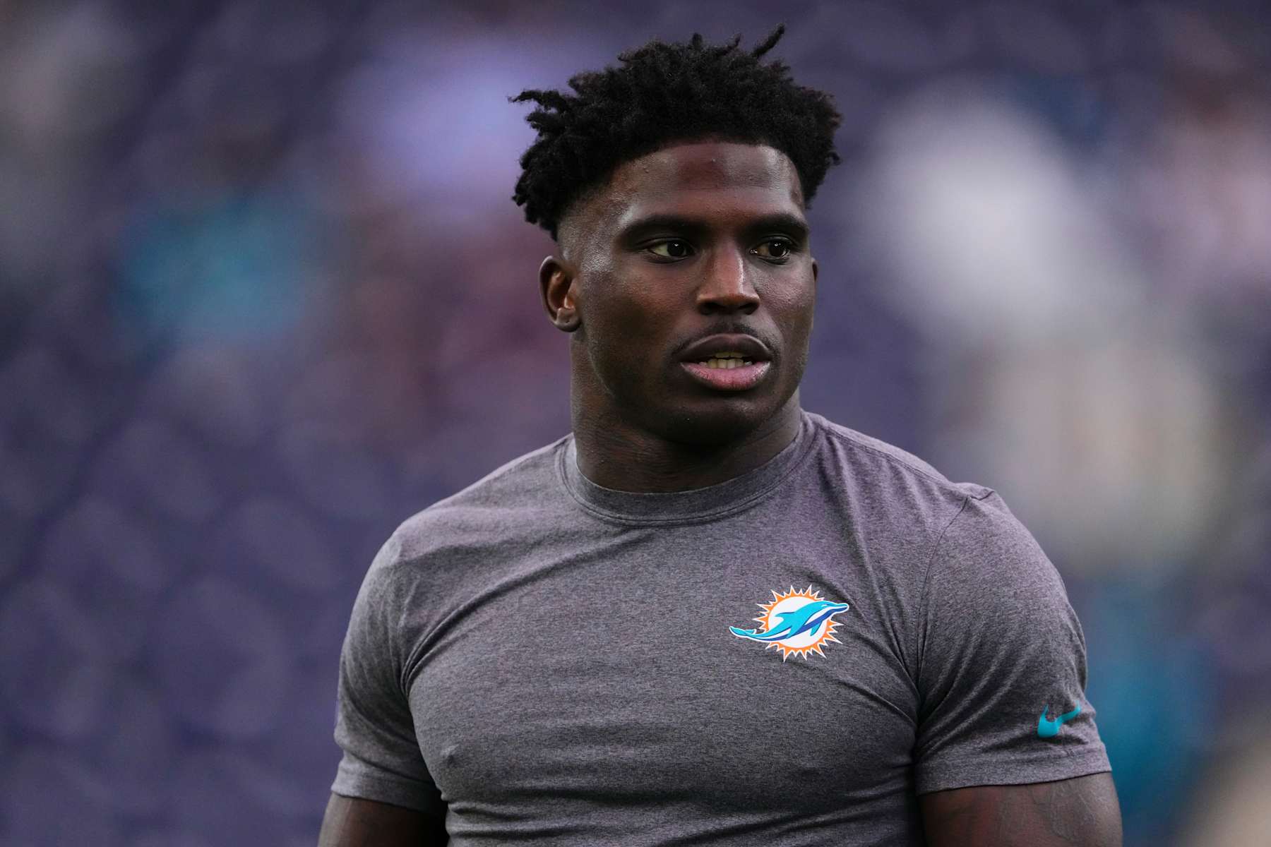 HOUSTON, TX - DECEMBER 15: Tyreek Hill #10 of the Miami Dolphins warms up before kickoff against the Houston Texans during an NFL football game at NRG Stadium on December 15, 2024 in Houston, Texas. (Photo by Cooper Neill/Getty Images)