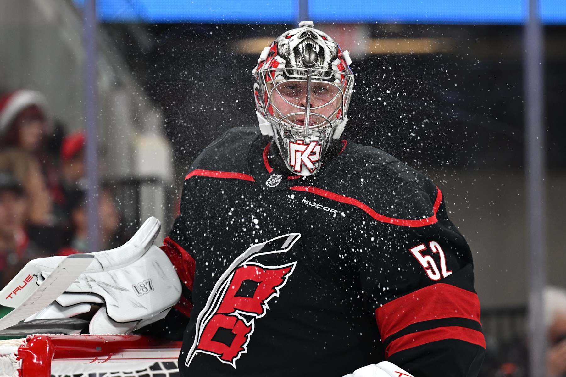 RALEIGH, NC - DECEMBER 17: Carolina Hurricanes goalie Pyotr Kochetkov (52) spits out water in between plays during the NHL game between the New York Islanders and the Carolina Hurricanes on December 17, 2024 at Lenovo Center in Raleigh, North Carolina. (Photo by Katherine Gawlik/Icon Sportswire via Getty Images)