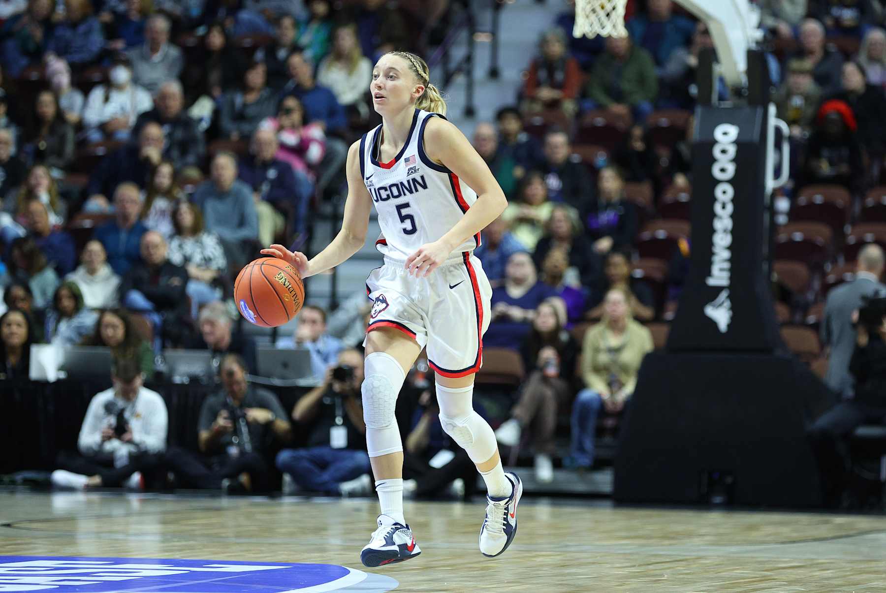 UNCASVILLE, CT - DECEMBER 17: UConn Huskies guard Paige Bueckers (5) dribbles the ball up court during the 2024 college Basketball Hall of Fame Women's Showcase game between Iowa State Cyclones and UConn Huskies on December 17, 2024, at Mohegan Sun Arena in Uncasville, CT. (Photo by M. Anthony Nesmith/Icon Sportswire via Getty Images)