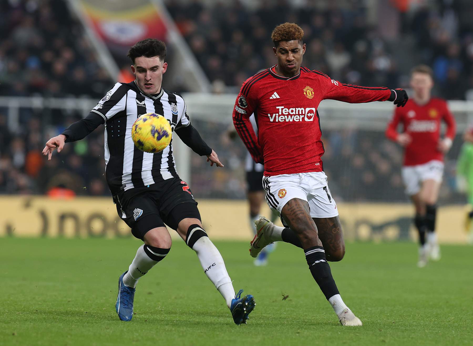 NEWCASTLE UPON TYNE, ENGLAND - DECEMBER 02: Marcus Rashford of Manchester United in action with Tino Livramento of Newcastle United during the Premier League match between Newcastle United and Manchester United at St. James Park on December 02, 2023 in Newcastle upon Tyne, England. (Photo by Matthew Peters/Manchester United via Getty Images)