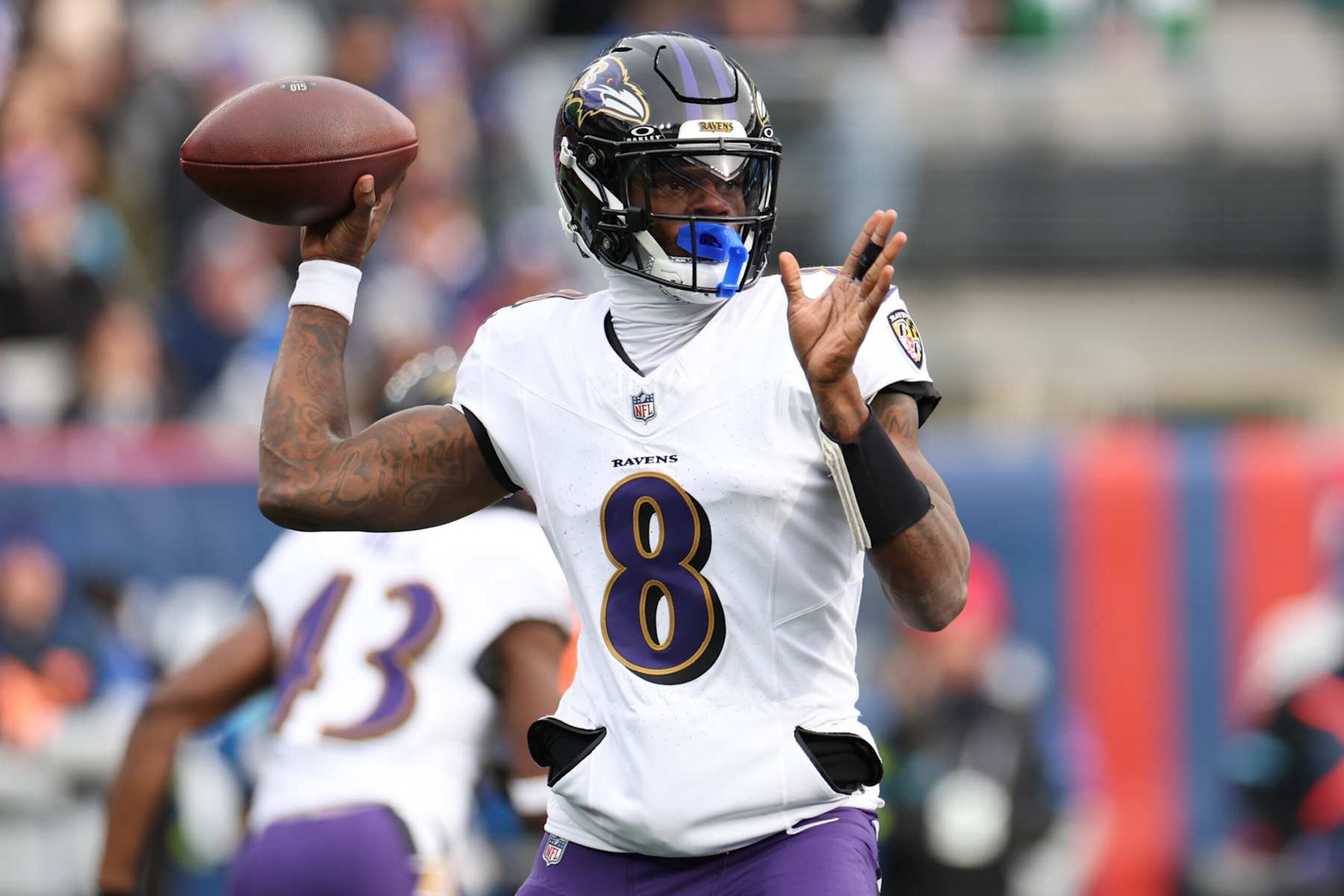 EAST RUTHERFORD, NEW JERSEY - DECEMBER 15: Lamar Jackson #8 of the Baltimore Ravens throws a pass against the New York Giants during the first quarter at MetLife Stadium on December 15, 2024 in East Rutherford, New Jersey. (Photo by Luke Hales/Getty Images)