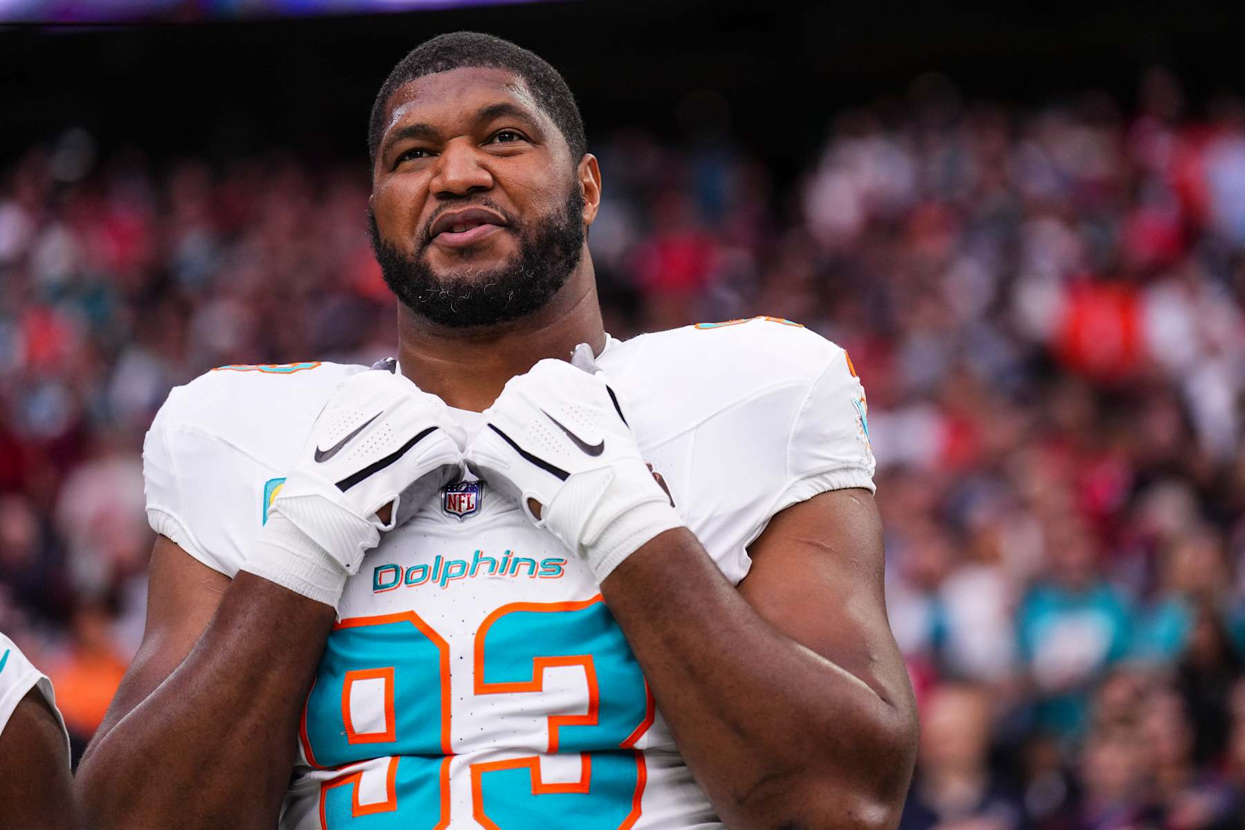 HOUSTON, TX - DECEMBER 15: Calais Campbell #93 of the Miami Dolphins looks on from the sideline prior to an NFL football game against the Houston Texans at NRG Stadium on December 15, 2024 in Houston, Texas. (Photo by Cooper Neill/Getty Images)