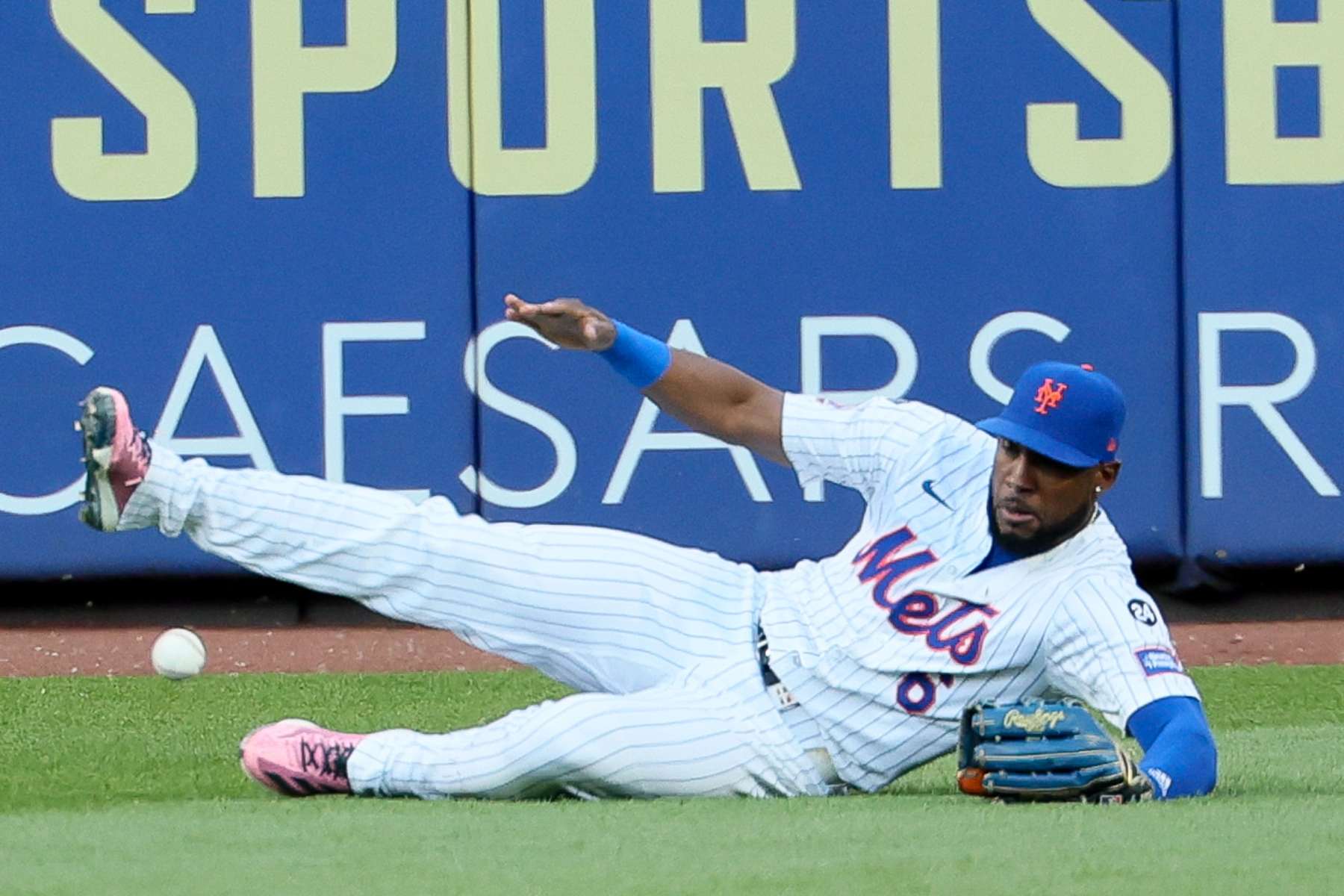 NEW YORK, NEW YORK - OCTOBER 18: Starling Marte #6 of the New York Mets cannot make a play on a double hit by Mookie Betts #50 of the Los Angeles Dodgers during the first inning in game five of the National League Championship Series at Citi Field on Friday, Oct. 18, 2024 in New York. (Robert Gauthier / Los Angeles Times via Getty Images)