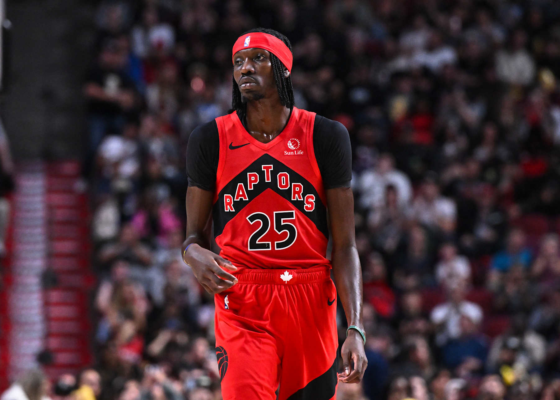 MONTREAL, CANADA - OCTOBER 06:  Chris Boucher #25 of the Toronto Raptors looks on during the second half in a preseason NBA game against the Washington Wizards at the Bell Centre on October 6, 2024 in Montreal, Quebec, Canada.  The Toronto Raptors defeated the Washington Wizards 125-98.  NOTE TO USER: User expressly acknowledges and agrees that, by downloading and or using this photograph, User is consenting to the terms and conditions of the Getty Images License Agreement.  (Photo by Minas Panagiotakis/Getty Images)