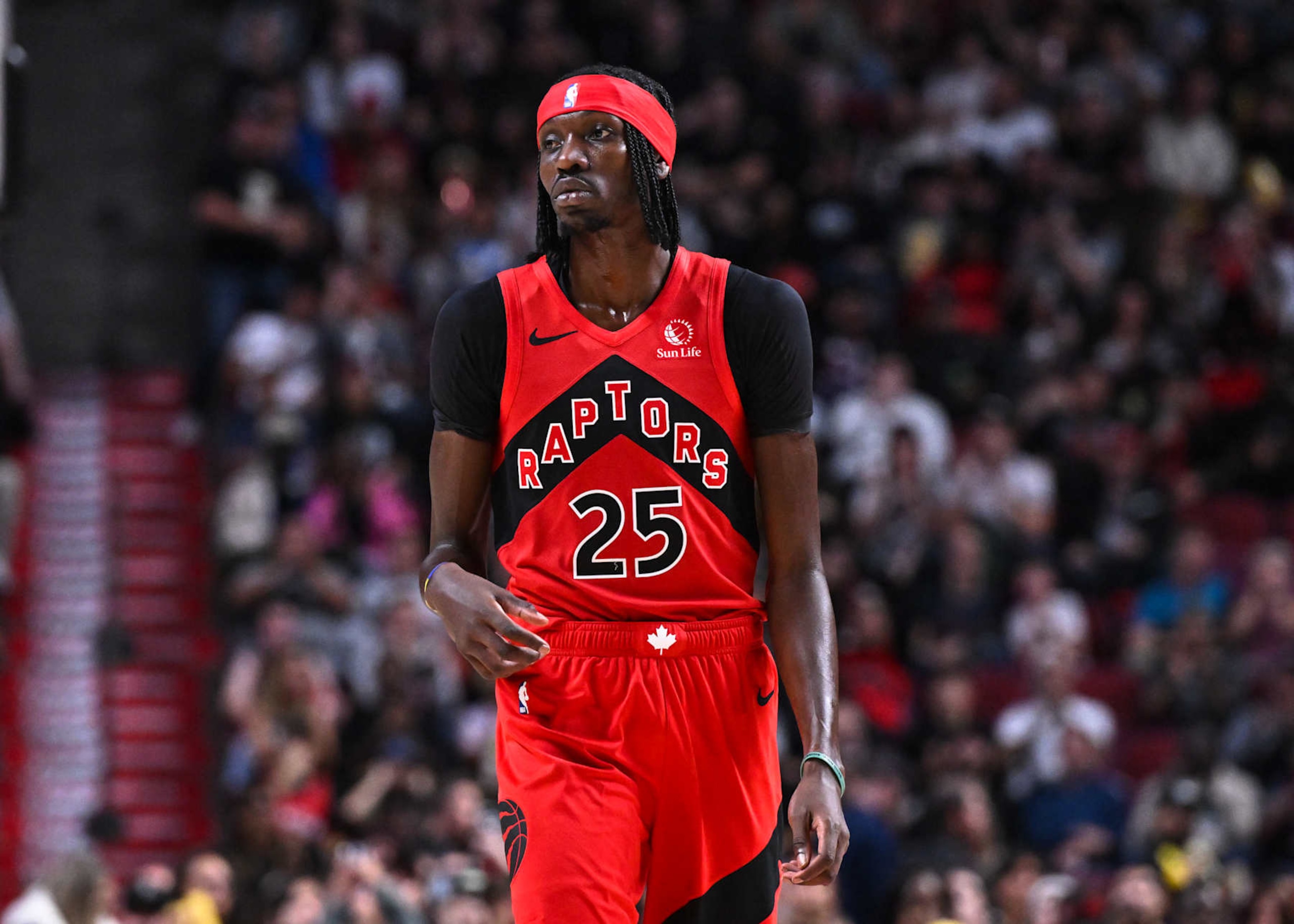 MONTREAL, CANADA - OCTOBER 06:  Chris Boucher #25 of the Toronto Raptors looks on during the second half in a preseason NBA game against the Washington Wizards at the Bell Centre on October 6, 2024 in Montreal, Quebec, Canada.  The Toronto Raptors defeated the Washington Wizards 125-98.  NOTE TO USER: User expressly acknowledges and agrees that, by downloading and or using this photograph, User is consenting to the terms and conditions of the Getty Images License Agreement.  (Photo by Minas Panagiotakis/Getty Images)
