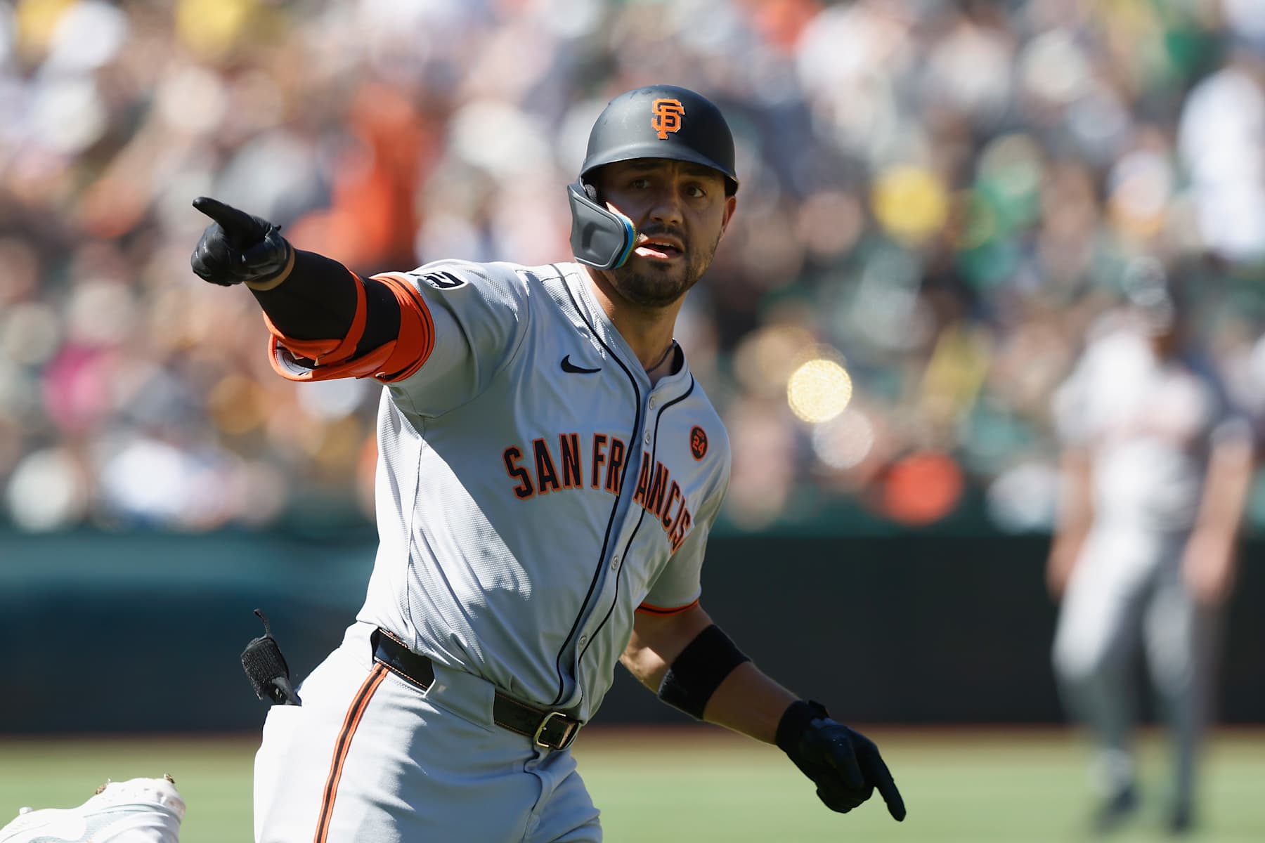 OAKLAND, CALIFORNIA - AUGUST 18: Michael Conforto #8 of the San Francisco Giants celebrates after hitting a solo home run in the top of the tenth inning against the Oakland Athletic at Oakland Coliseum on August 18, 2024 in Oakland, California. (Photo by Lachlan Cunningham/Getty Images)