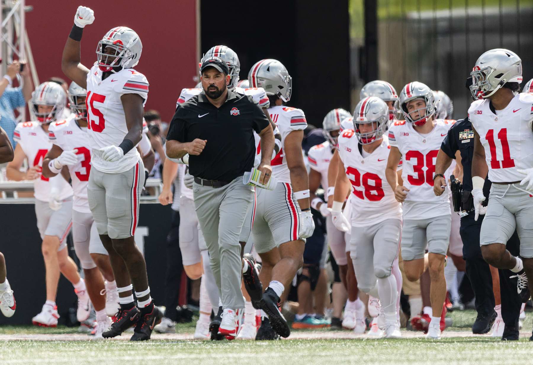 BLOOMINGTON, INDIANA - SEPTEMBER 2: Head coach Ryan Day of the Ohio State Buckeyes runs out with the team before the game against the Indiana Hoosiers at Memorial Stadium on September 2, 2023 in Bloomington, Indiana. (Photo by Michael Hickey/Getty Images)