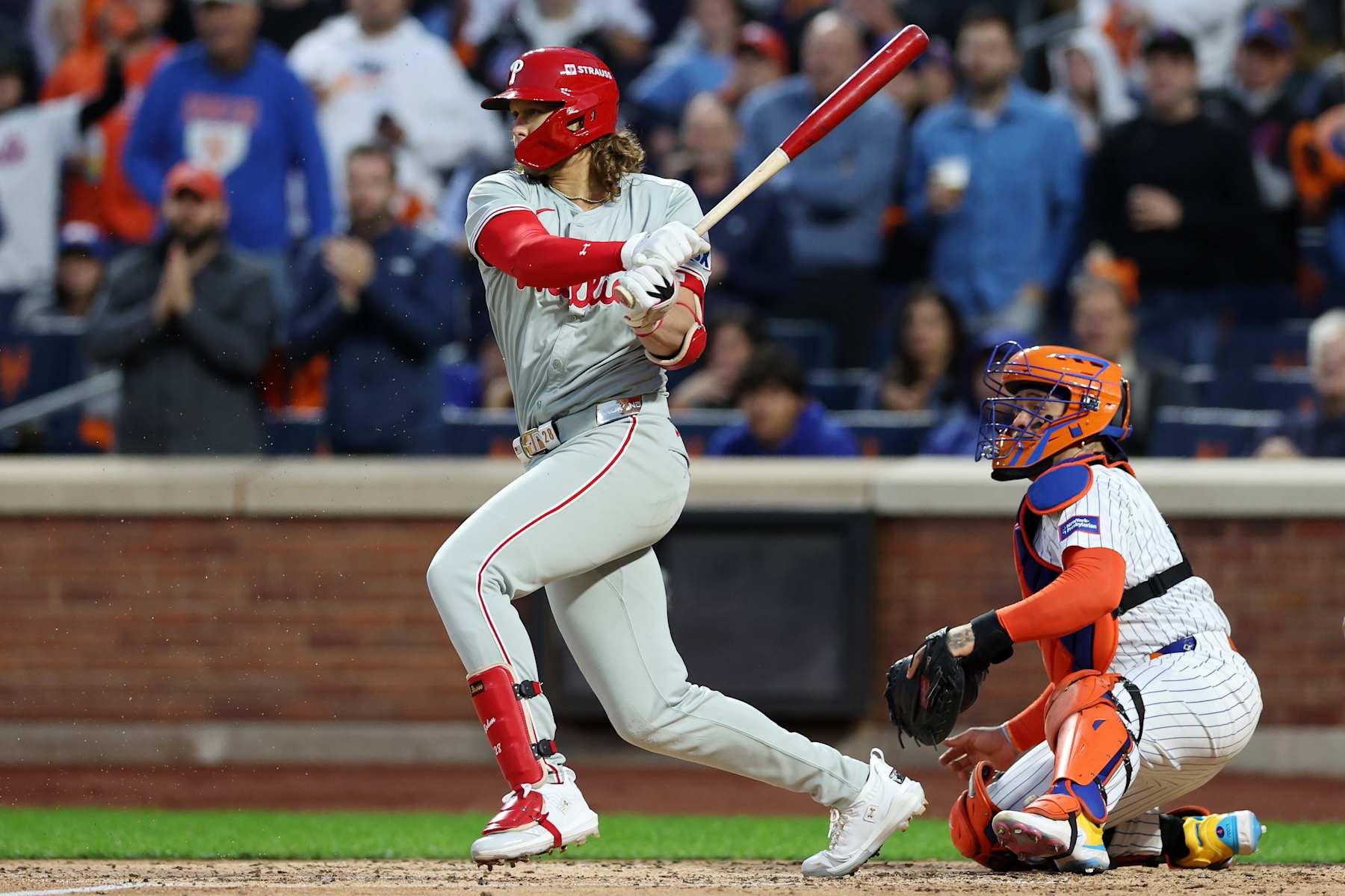 NEW YORK, NEW YORK - OCTOBER 09: Alec Bohm #28 of the Philadelphia Phillies reaches on a fielder's choice in the fourth inning against the New York Mets during Game Four of the Division Series at Citi Field on October 09, 2024 in New York City. (Photo by Elsa/Getty Images)