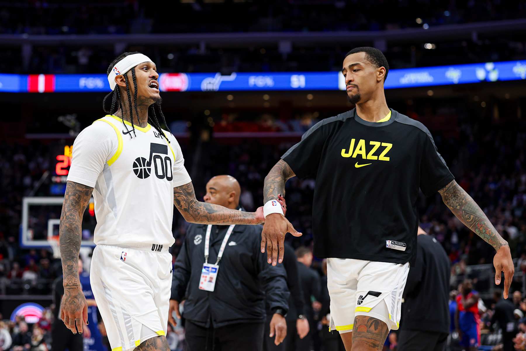 DETROIT, MICHIGAN - DECEMBER 19: Jordan Clarkson #00 of the Utah Jazz high-fives John Collins #20 during the third quarter of a game against the Detroit Pistons at Little Caesars Arena on December 19, 2024 in Detroit, Michigan. NOTE TO USER: User expressly acknowledges and agrees that, by downloading and or using this photograph, User is consenting to the terms and conditions of the Getty Images License Agreement. (Photo by Mike Mulholland/Getty Images)