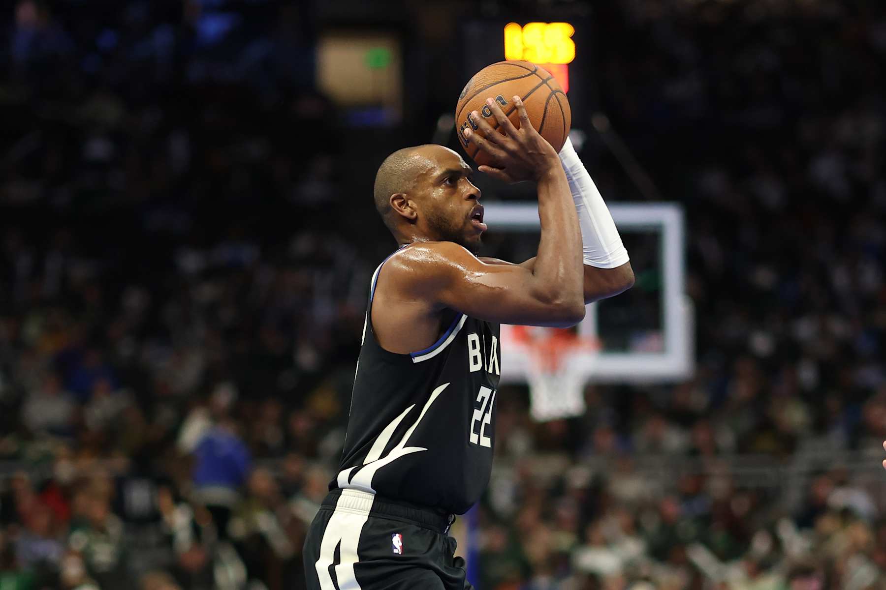 MILWAUKEE, WISCONSIN - DECEMBER 10: Khris Middleton #22 of the Milwaukee Bucks takes a shot during the first half of a game against the Orlando Magic in the NBA Emirates Cup Quarterfinal at Fiserv Forum on December 10, 2024 in Milwaukee, Wisconsin.  NOTE TO USER: User expressly acknowledges and agrees that, by downloading and or using this photograph, User is consenting to the terms and conditions of the Getty Images License Agreement. (Photo by Stacy Revere/Getty Images)